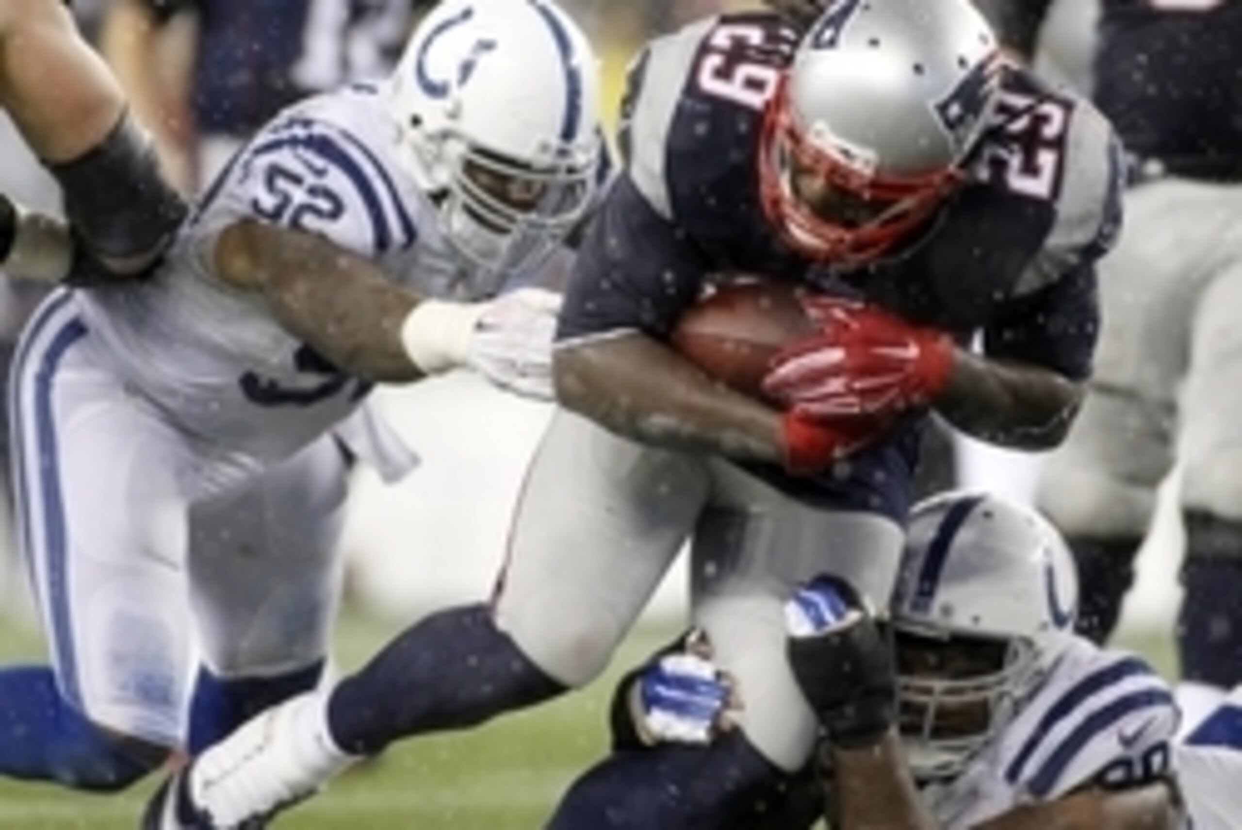 Jan 18, 2015; Foxborough, MA, USA; New England Patriots running back LeGarrette Blount (29) runs the ball against Indianapolis Colts inside linebacker D'Qwell Jackson (52) during the fourth quarter in the AFC Championship Game at Gillette Stadium. Mandato Jan 18, 2015; Foxborough, MA, USA; New England Patriots running back LeGarrette Blount (29) runs the ball against Indianapolis Colts inside linebacker D'Qwell Jackson (52) during the fourth quarter in the AFC Championship Game at Gillette Stadium. Mandato