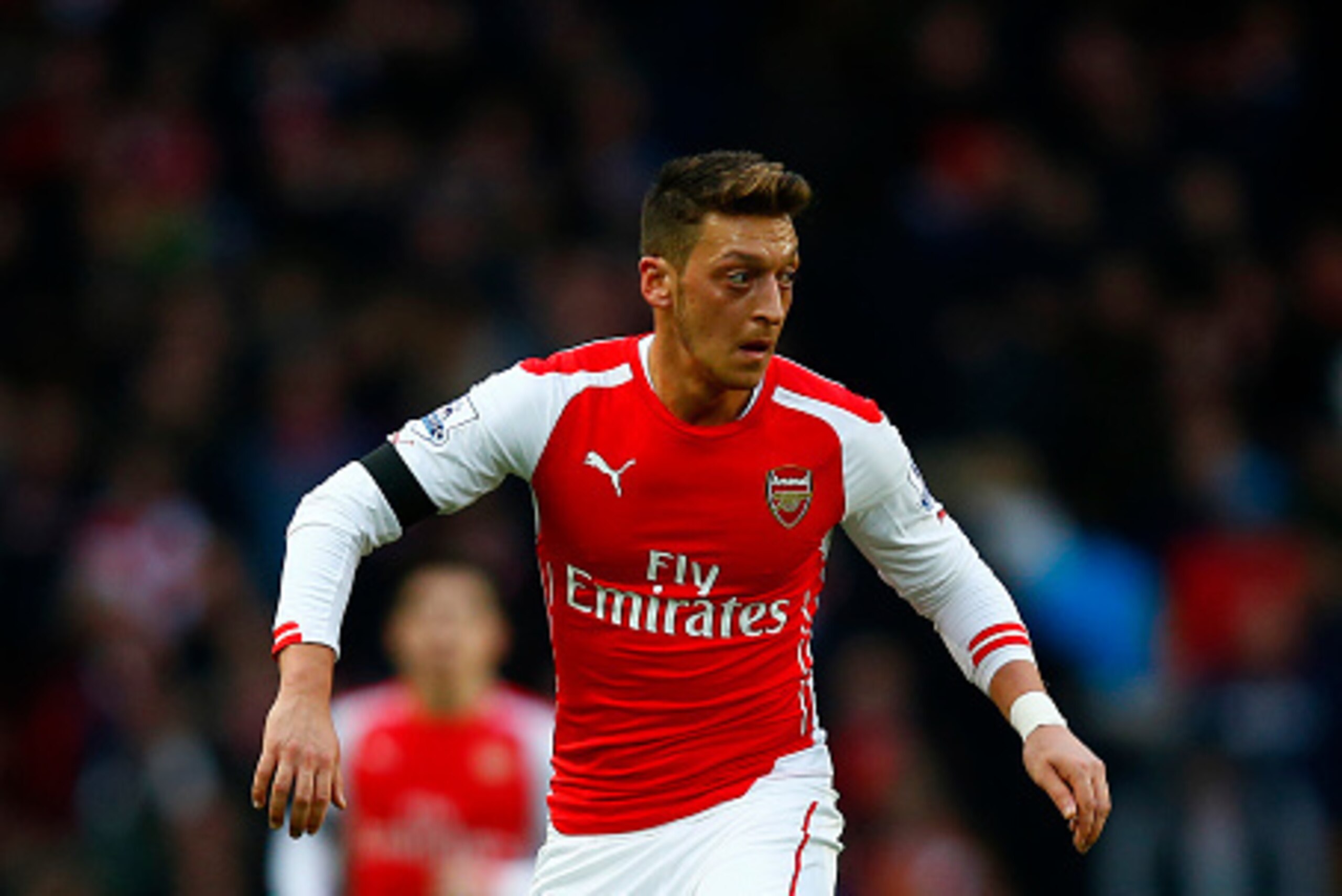 LONDON, ENGLAND - JANUARY 11:  Mesut Oezil of Arsenal in action during the Barclays Premier League match between Arsenal and Stoke City at Emirates Stadium on January 11, 2015 in London, England.  (Photo by Clive Rose/Getty Images)