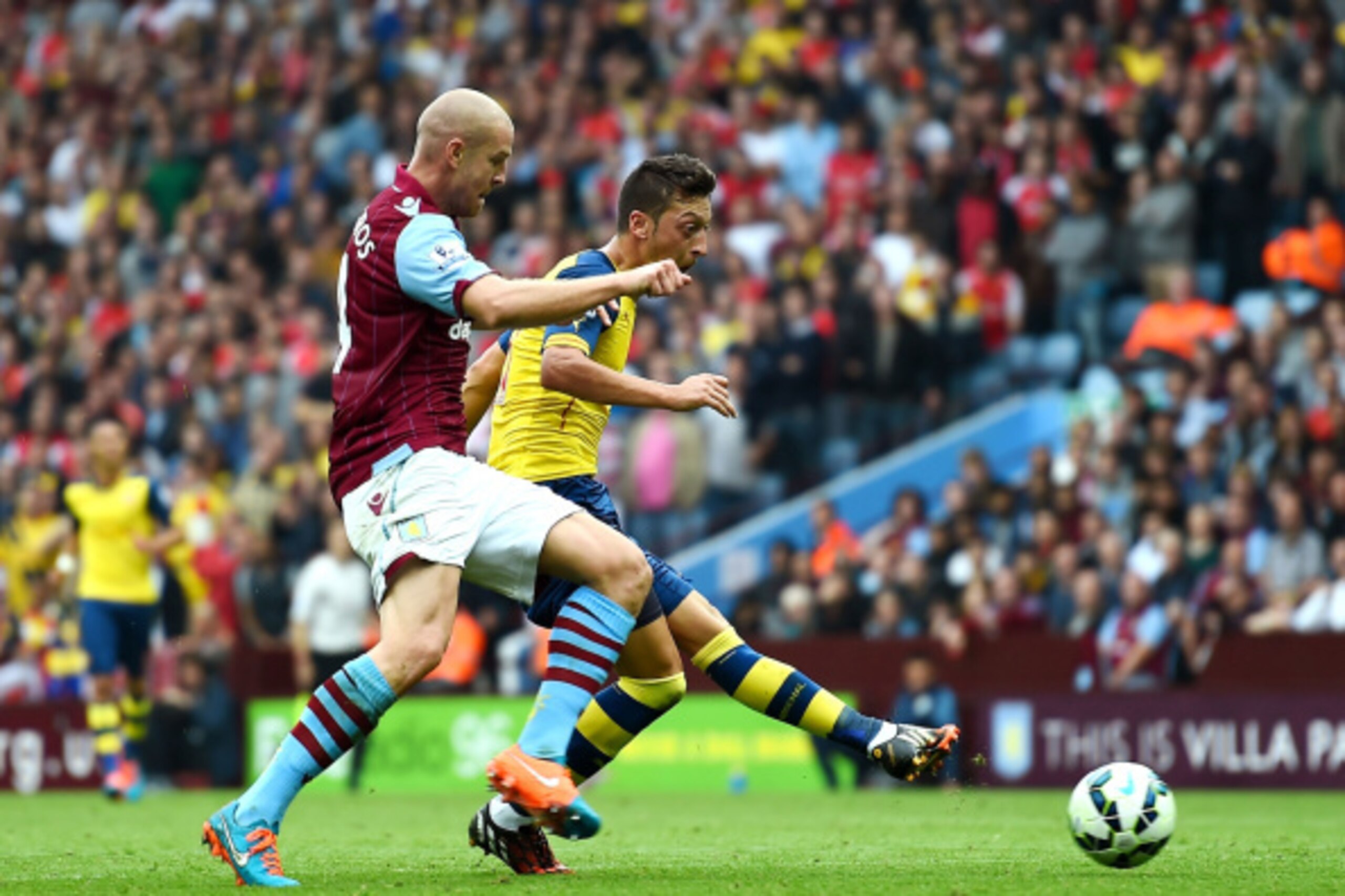 BIRMINGHAM, ENGLAND - SEPTEMBER 20:  Mesut Oezil of Arsenal scores the opening goal during the Barclays Premier League match between Aston Villa and Arsenal at Villa Park on September 20, 2014 in Birmingham, England.  (Photo by Laurence Griffiths/Getty Im