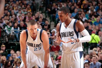 DALLAS, TX - JANUARY 16: Chandler Parsons #25 and Rajon Rondo #9 of the Dallas Mavericks talk during the game against the Denver Nuggets on January 16, 2015 at the American Airlines Center in Dallas, Texas. NOTE TO USER: User expressly acknowledges and ag