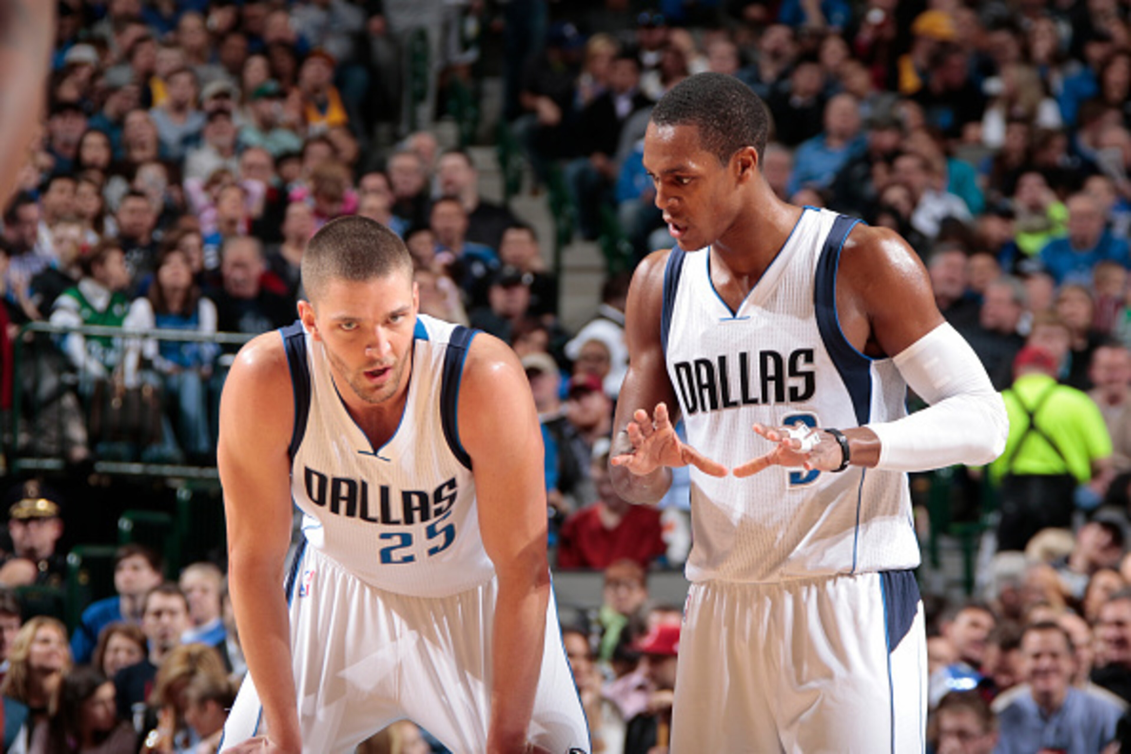 DALLAS, TX - JANUARY 16: Chandler Parsons #25 and Rajon Rondo #9 of the Dallas Mavericks talk during the game against the Denver Nuggets on January 16, 2015 at the American Airlines Center in Dallas, Texas. NOTE TO USER: User expressly acknowledges and ag