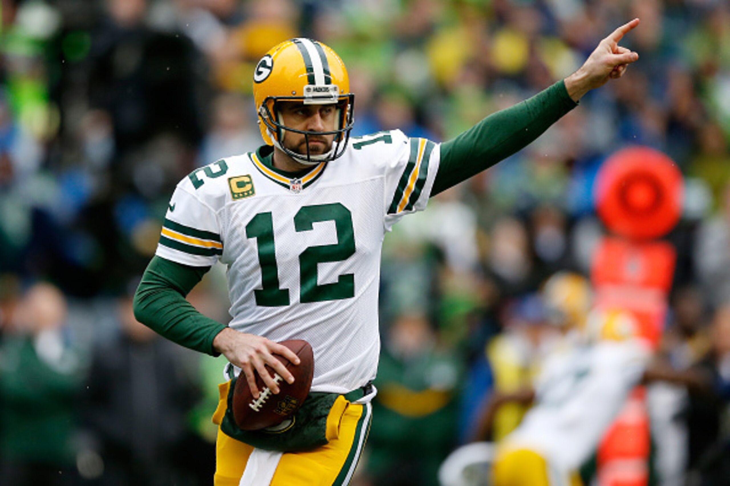 SEATTLE, WA - JANUARY 18:  Aaron Rodgers #12 of the Green Bay Packers reacts in the first quarter against the Seattle Seahawks during the 2015 NFC Championship game at CenturyLink Field on January 18, 2015 in Seattle, Washington.  (Photo by Otto Greule Jr