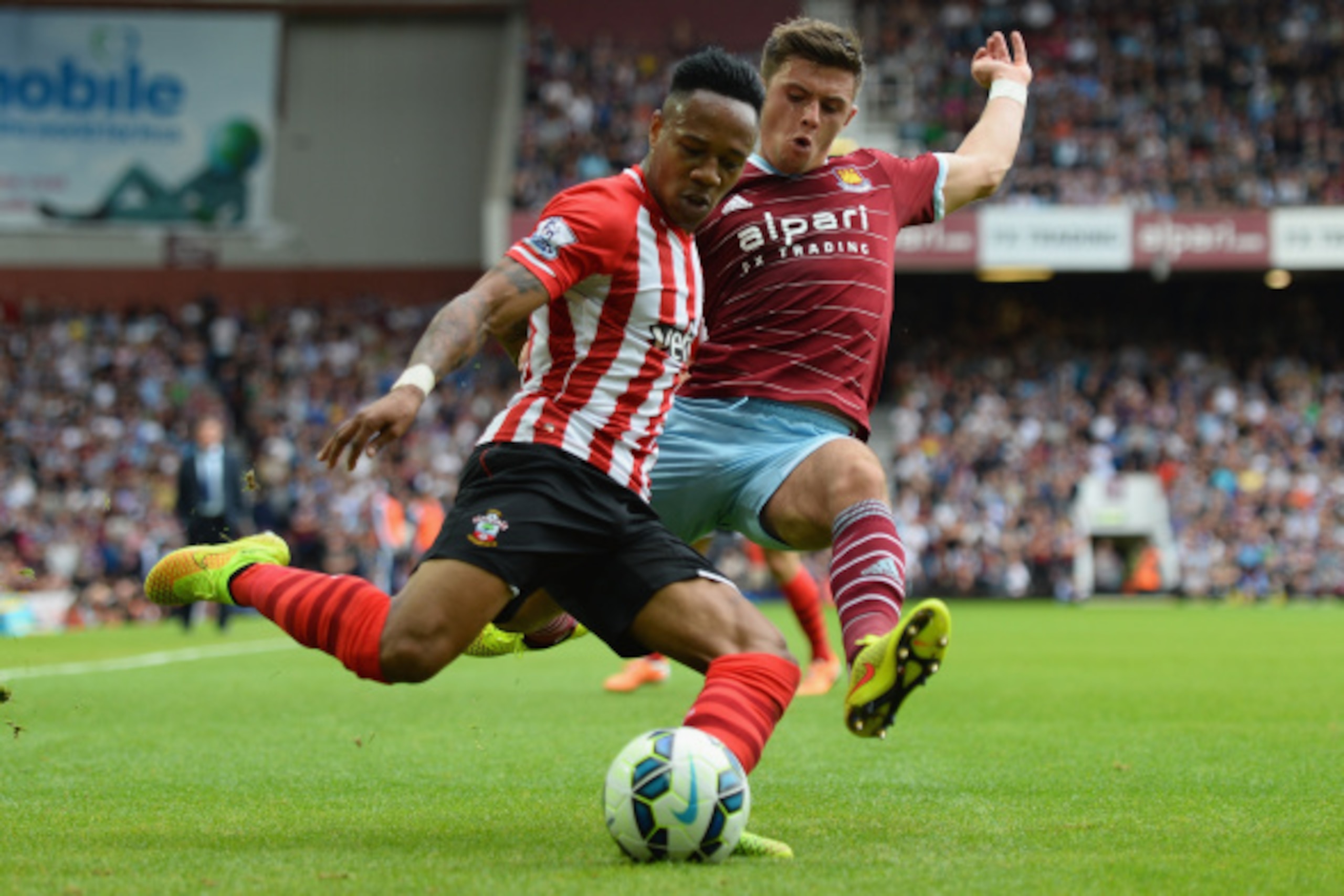 LONDON, ENGLAND - AUGUST 30: Aaron Cresswell of West Ham battles with Nathaniel Clyne of Southampton during the Barclays Premier League match between West Ham United and Southampton at Boleyn Ground on August 30, 2014 in London, England. (Photo by Jami LONDON, ENGLAND - AUGUST 30: Aaron Cresswell of West Ham battles with Nathaniel Clyne of Southampton during the Barclays Premier League match between West Ham United and Southampton at Boleyn Ground on August 30, 2014 in London, England. (Photo by Jami