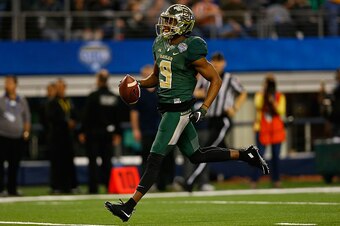 ARLINGTON, TX - JANUARY 01:  KD Cannon #9 of the Baylor Bears runs for a touchdown after the catch against the  Michigan State Spartans during the second half of the Goodyear Cotton Bowl Classic at AT&T Stadium on January 1, 2015 in Arlington, Texas.  (Ph