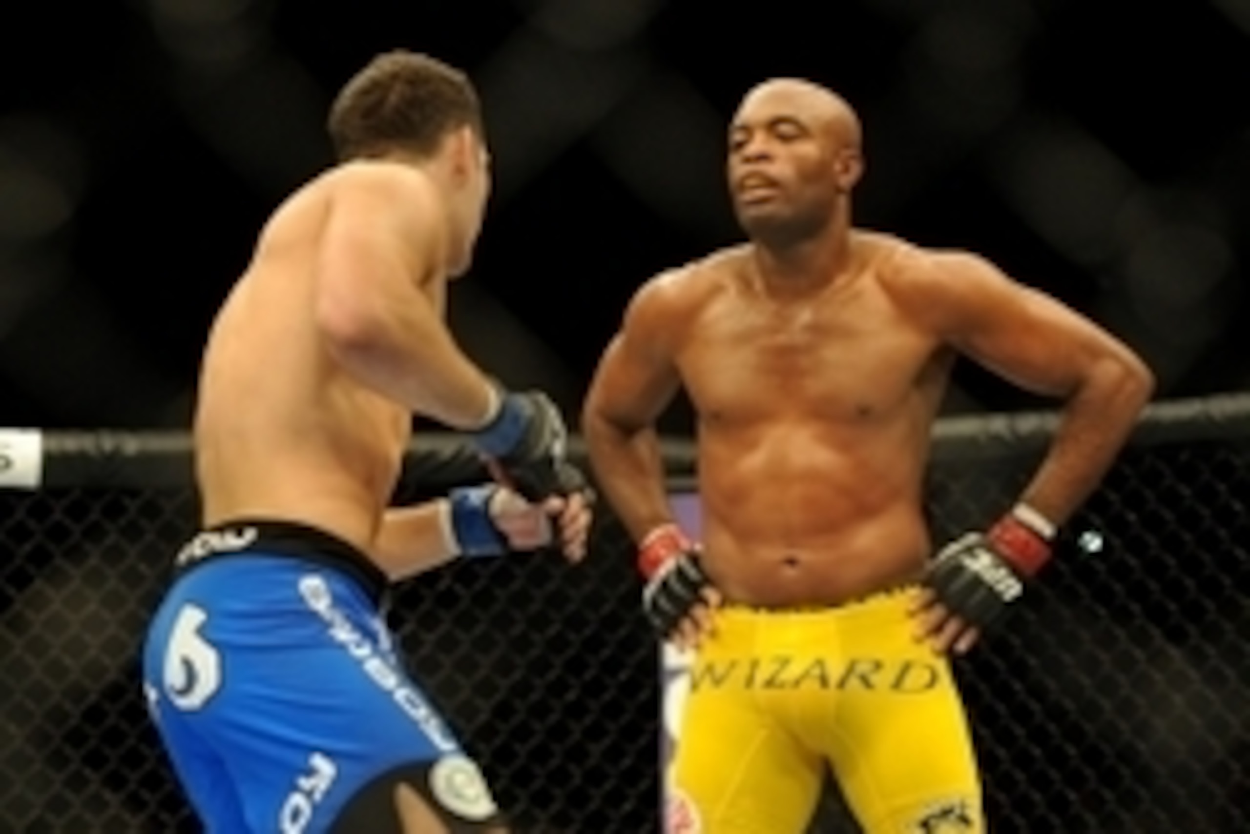 Jul 6, 2013; Las Vegas, NV, USA;  Chris Weidman, blue shorts, defeated Anderson Silva (yellow shorts) in the second round with a TKO in their Middleweight Chamionship Bout at the MGM Grand Garden Arena. Mandatory Credit: Jayne Kamin-Oncea-USA TODAY Sports