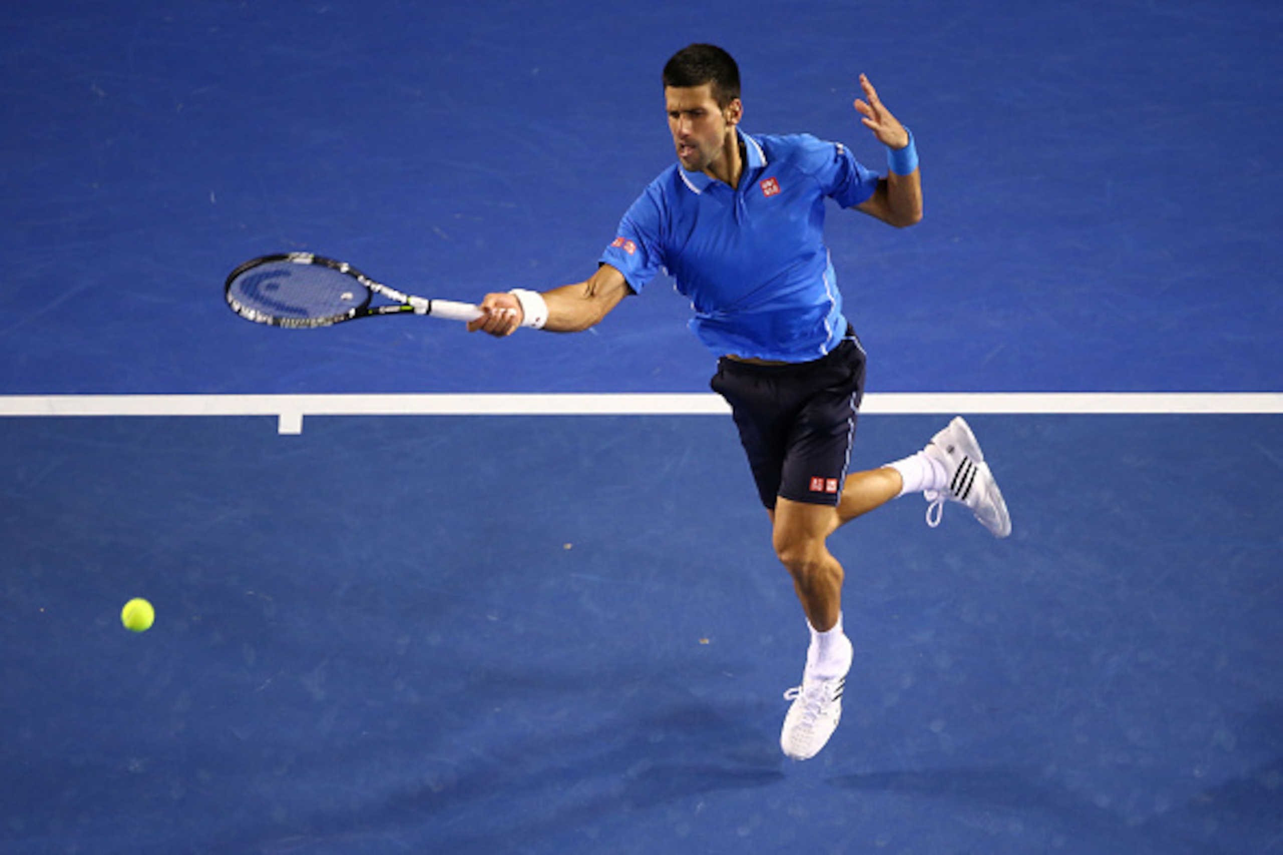 MELBOURNE, AUSTRALIA - JANUARY 30:  Novak Djokovic of Serbia plays a forehand in his semifinal match against Stanislas Wawrinka of Switzerland during day 12 of the 2015 Australian Open at Melbourne Park on January 30, 2015 in Melbourne, Australia.  (Photo