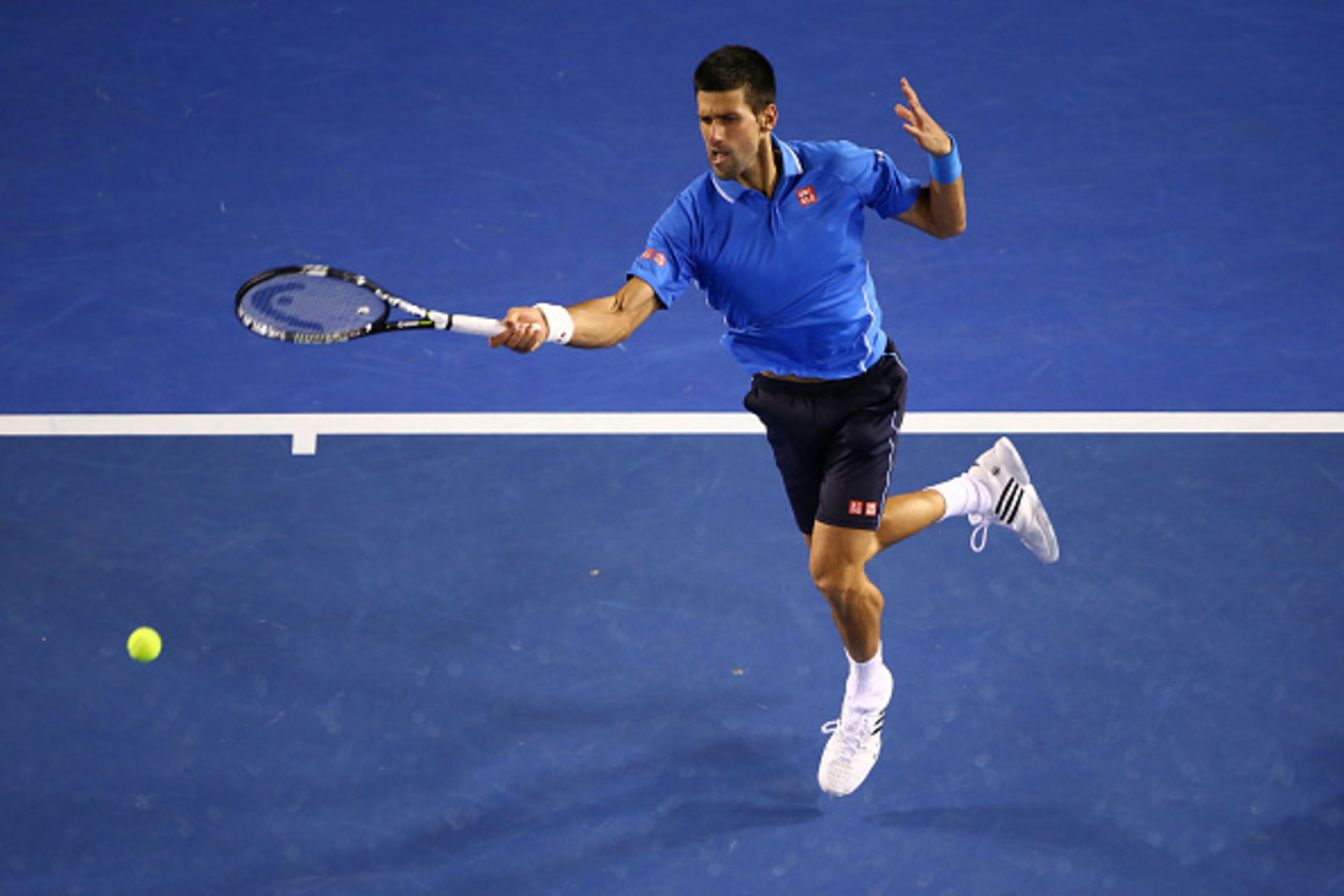 MELBOURNE, AUSTRALIA - JANUARY 30:  Novak Djokovic of Serbia plays a forehand in his semifinal match against Stanislas Wawrinka of Switzerland during day 12 of the 2015 Australian Open at Melbourne Park on January 30, 2015 in Melbourne, Australia.  (Photo