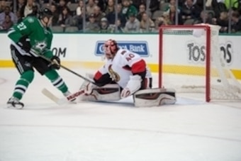 Jan 13, 2015; Dallas, TX, USA; Dallas Stars left wing Travis Moen (27) watches a shot by defenseman Trevor Daley (not pictured) get by Ottawa Senators goalie Robin Lehner (40) during the second period at the American Airlines Center. Mandatory Credit: Jer