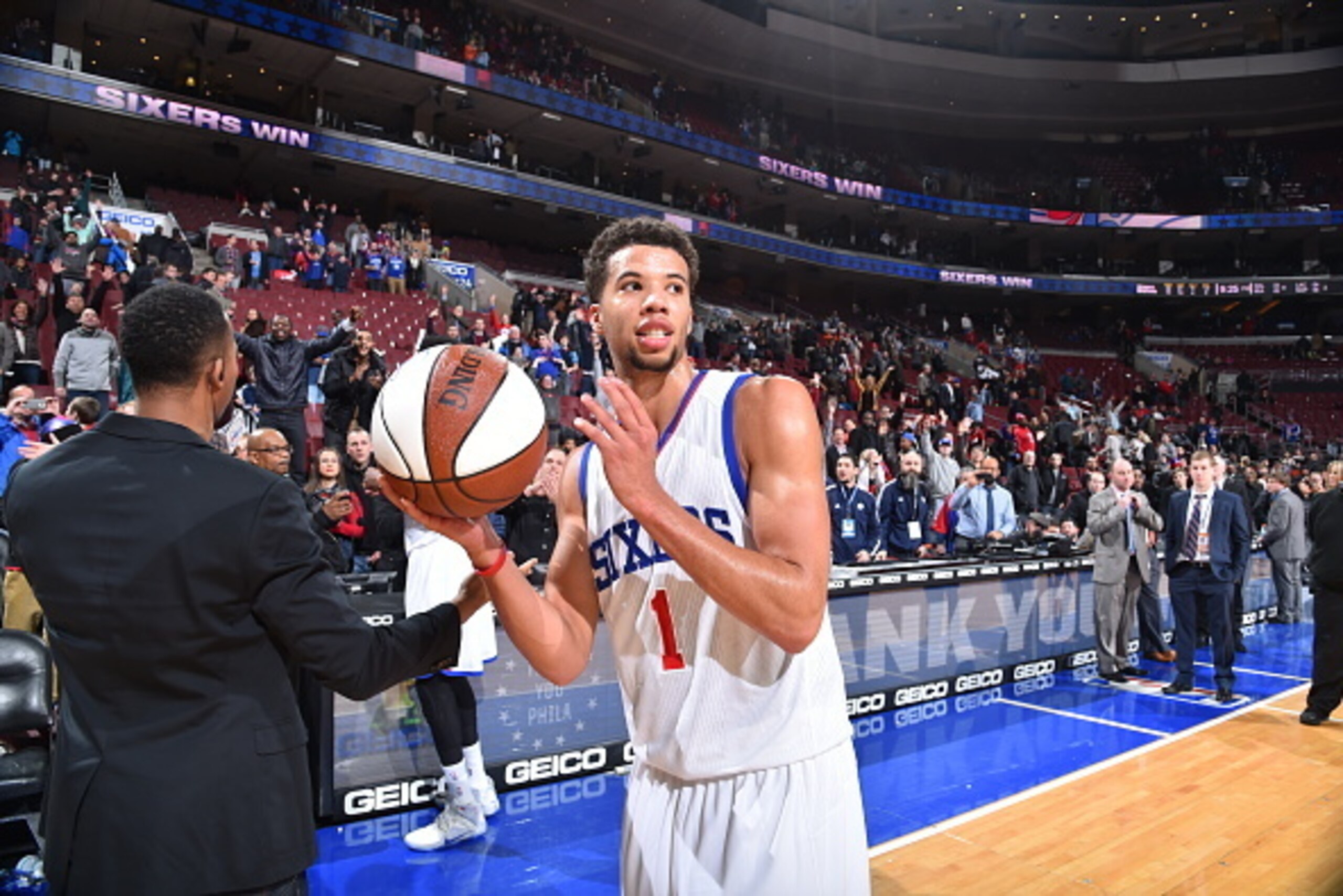 PHILADELPHIA, PA JANUARY 30: Michael Carter-Williams #1 of the Philadelphia 76ers signs a basketball and throws it into the crowd after the big win against the Minnesota Timberwolves at Wells Fargo Center on January 30, 2015 in Philadelphia, Pennsylvania PHILADELPHIA, PA JANUARY 30: Michael Carter-Williams #1 of the Philadelphia 76ers signs a basketball and throws it into the crowd after the big win against the Minnesota Timberwolves at Wells Fargo Center on January 30, 2015 in Philadelphia, Pennsylvania