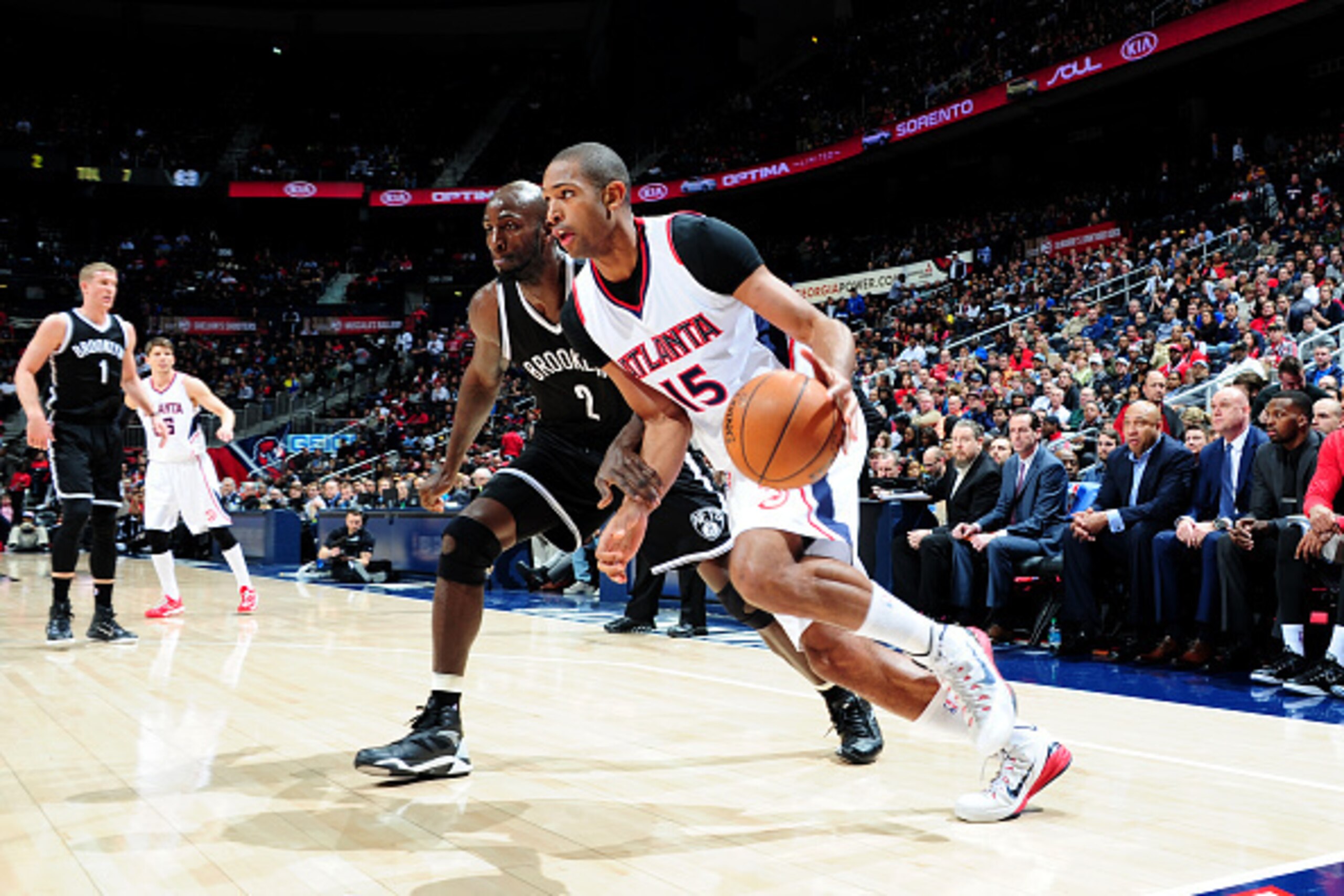 ATLANTA, GA - JANUARY 28: Al Horford #15 of the Atlanta Hawks drives baseline against Kevin Garnett #2 of the Brooklyn Nets on January 28, 2015 at Philips Arena in Atlanta, Georgia. NOTE TO USER: User expressly acknowledges and agrees that, by downloadi ATLANTA, GA - JANUARY 28: Al Horford #15 of the Atlanta Hawks drives baseline against Kevin Garnett #2 of the Brooklyn Nets on January 28, 2015 at Philips Arena in Atlanta, Georgia. NOTE TO USER: User expressly acknowledges and agrees that, by downloadi