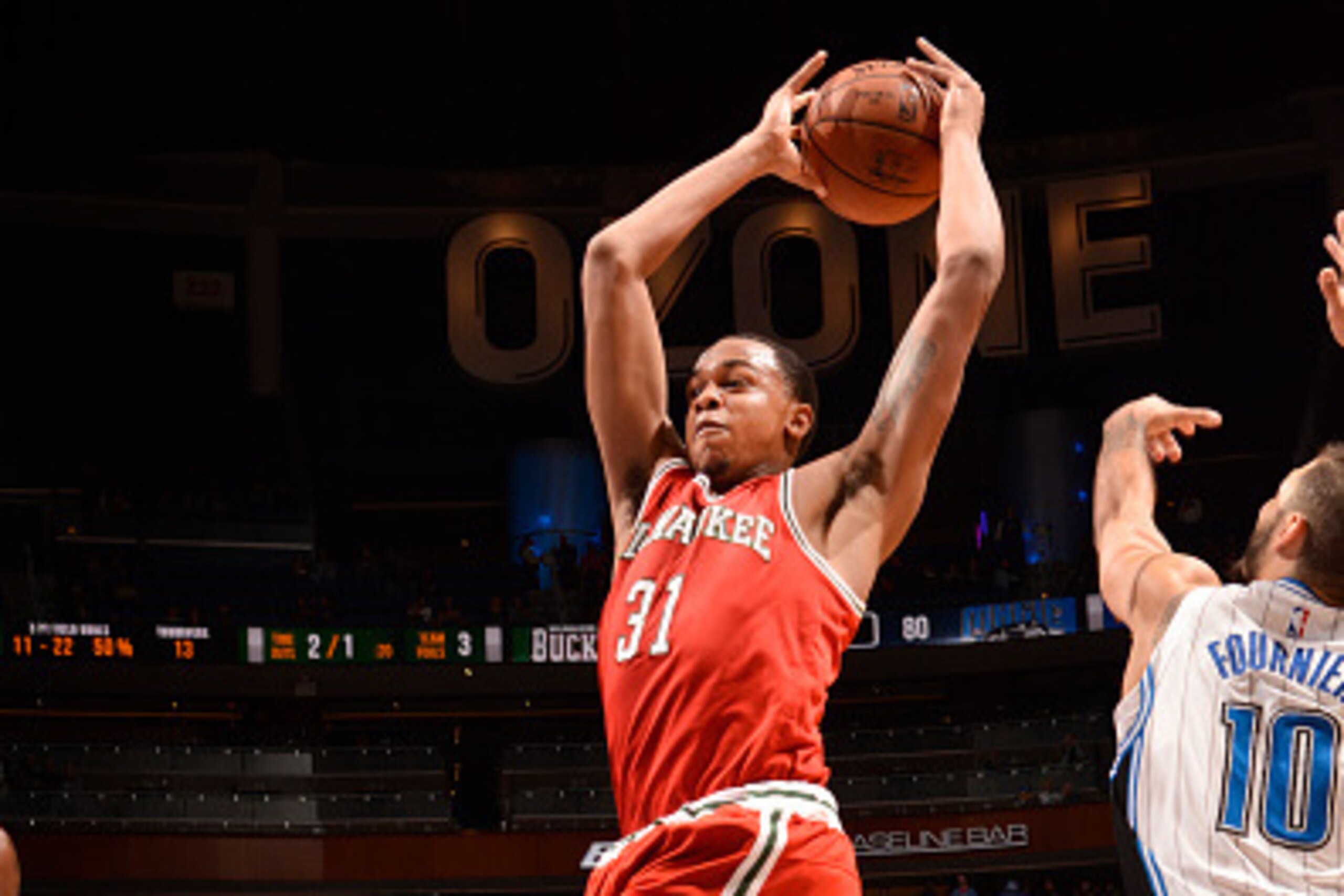 ORLANDO, FL - JANUARY 29: John Henson #31 of the Milwaukee Bucks looks to move the ball against the Orlando Magic during the game on January 29, 2015 at Amway Center in Orlando, Florida . NOTE TO USER: User expressly acknowledges and agrees that, by down ORLANDO, FL - JANUARY 29: John Henson #31 of the Milwaukee Bucks looks to move the ball against the Orlando Magic during the game on January 29, 2015 at Amway Center in Orlando, Florida . NOTE TO USER: User expressly acknowledges and agrees that, by down