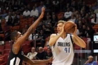 Jan 30, 2015; Miami, FL, USA; Dallas Mavericks forward Dirk Nowitzki (41) is pressured by Miami Heat center Chris Bosh (1) during the first half at American Airlines Arena. Mandatory Credit: Steve Mitchell-USA TODAY Sports