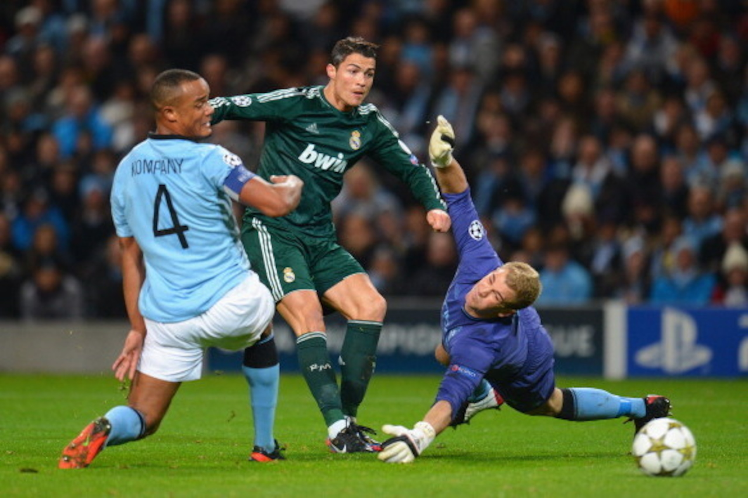MANCHESTER, ENGLAND - NOVEMBER 21:  Joe Hart of Manchester City dives to save the attempt on goal of Cristiano Ronaldo of Real Madrid during the UEFA Champions League Group D match between Manchester City FC and Real Madrid CF at the Etihad Stadium on Nov