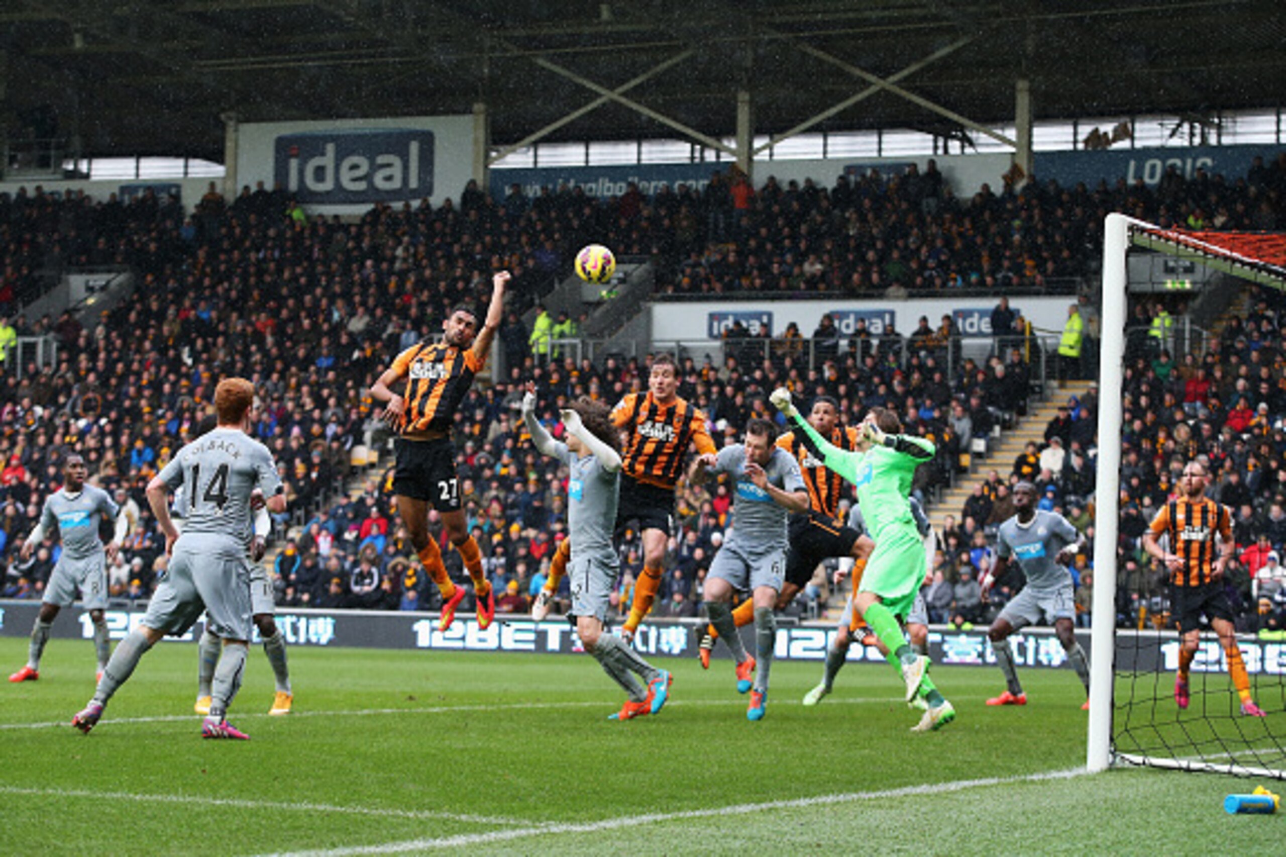 HULL, ENGLAND - JANUARY 31: Ahmed Elmohamady of Hull City punches the ball into the Newcastle net during the Barclays Premier League match between Hull City and Newcastle United at KC Stadium on January 31, 2015 in Hull, England.  (Photo by Jan Kruger/Get