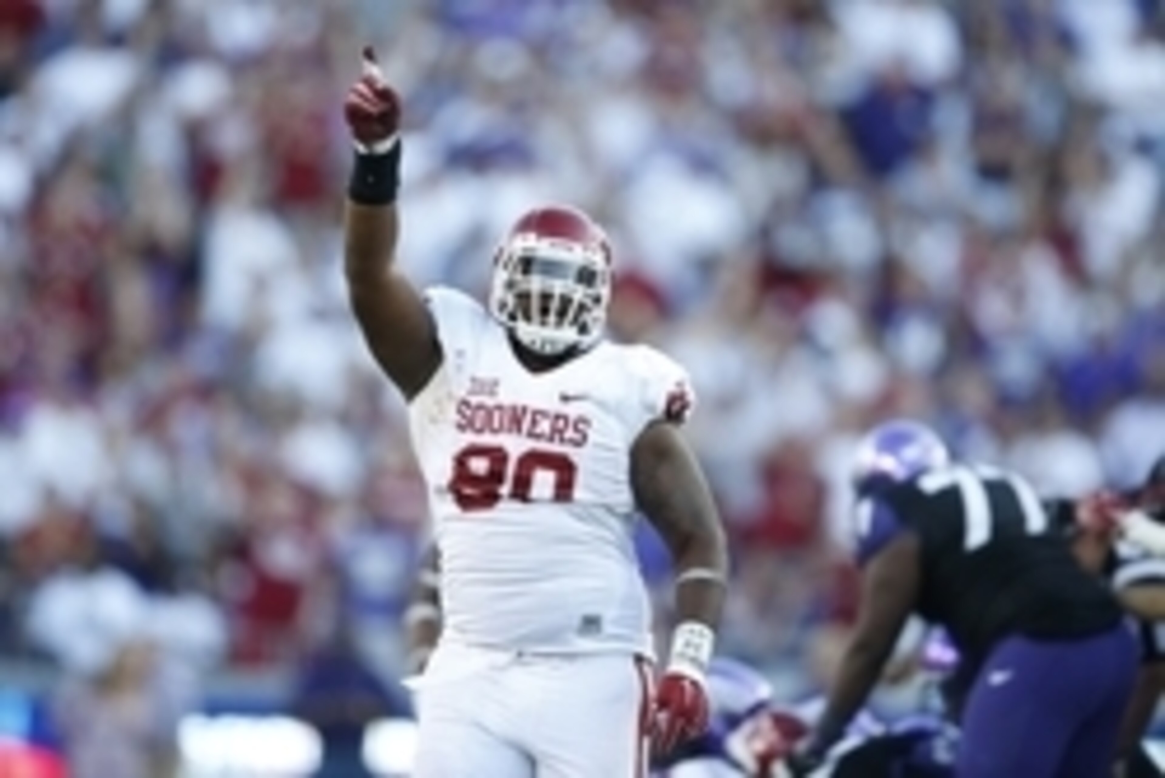 Oct 4, 2014; Fort Worth, TX, USA; Oklahoma Sooners defensive tackle Jordan Phillips (80) celebrates a turnover against the TCU Horned Frogs at Amon G. Carter Stadium. Mandatory Credit: Matthew Emmons-USA TODAY Sports