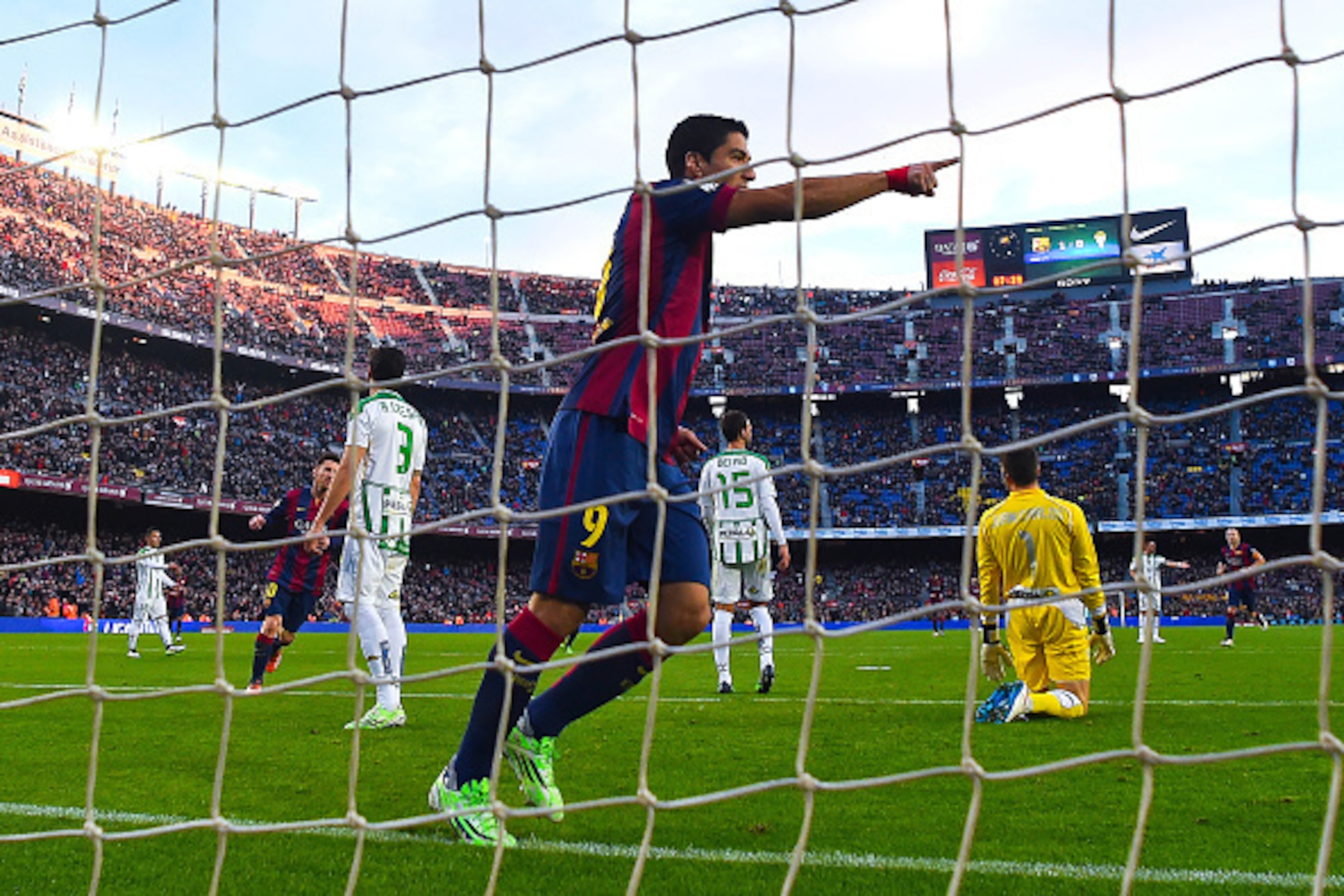 BARCELONA, SPAIN - DECEMBER 20:  Luis Suarez of FC Barcelona celebrates  after scoring his team's second goalduring the La Liga match between FC Barcelona and Cordoba CF at Camp Nou on December 20, 2014 in Barcelona, Spain.  (Photo by David Ramos/Getty Im