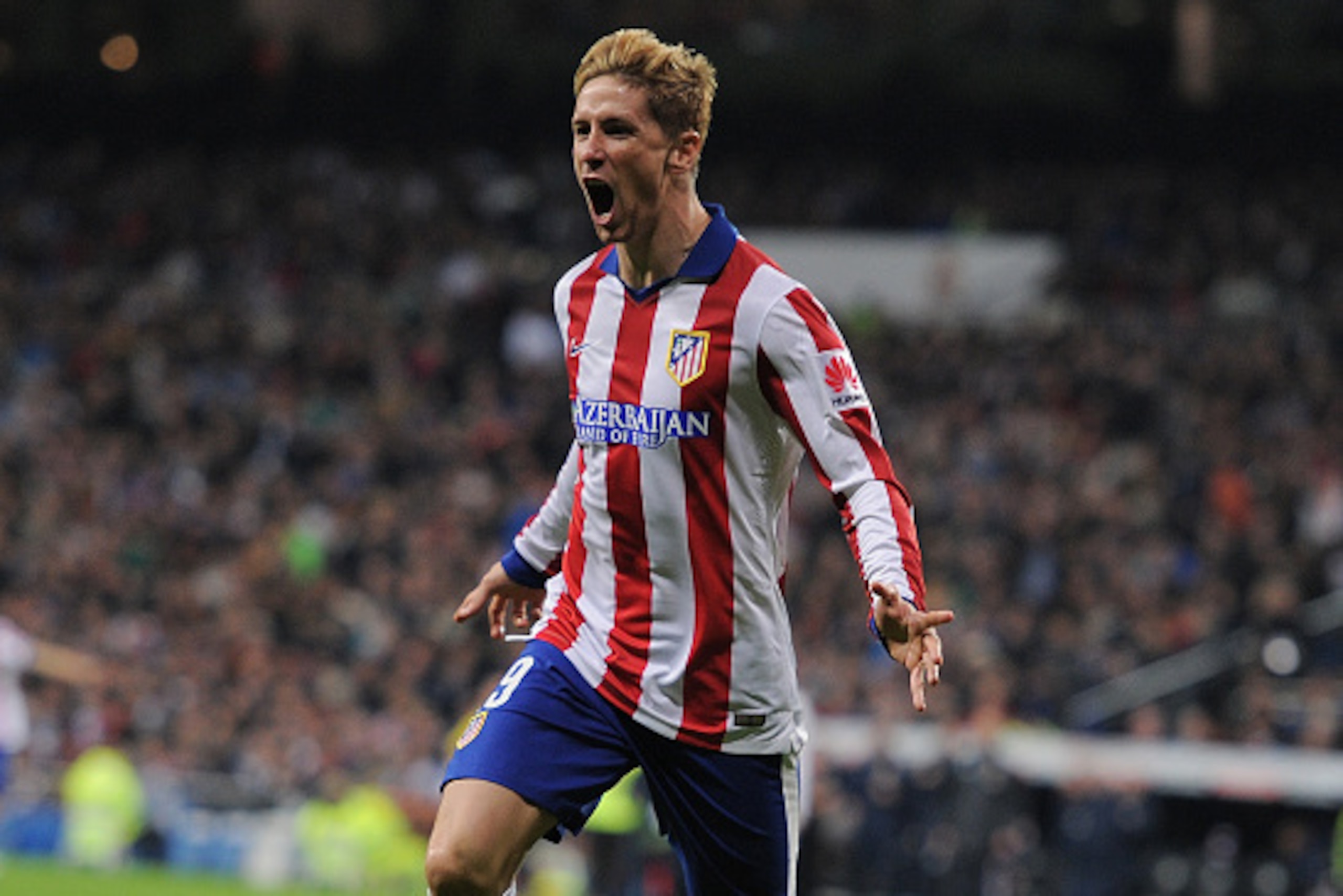 MADRID, SPAIN - JANUARY 15:  Fernando Torres of Atletico de Madrid celebrates after scoring Atletico's opening goal during the Copa del Rey Round of 16, Second leg match between Real Madrid and Atletico de Madrid at Estadio Santiago Bernabeu on January 15