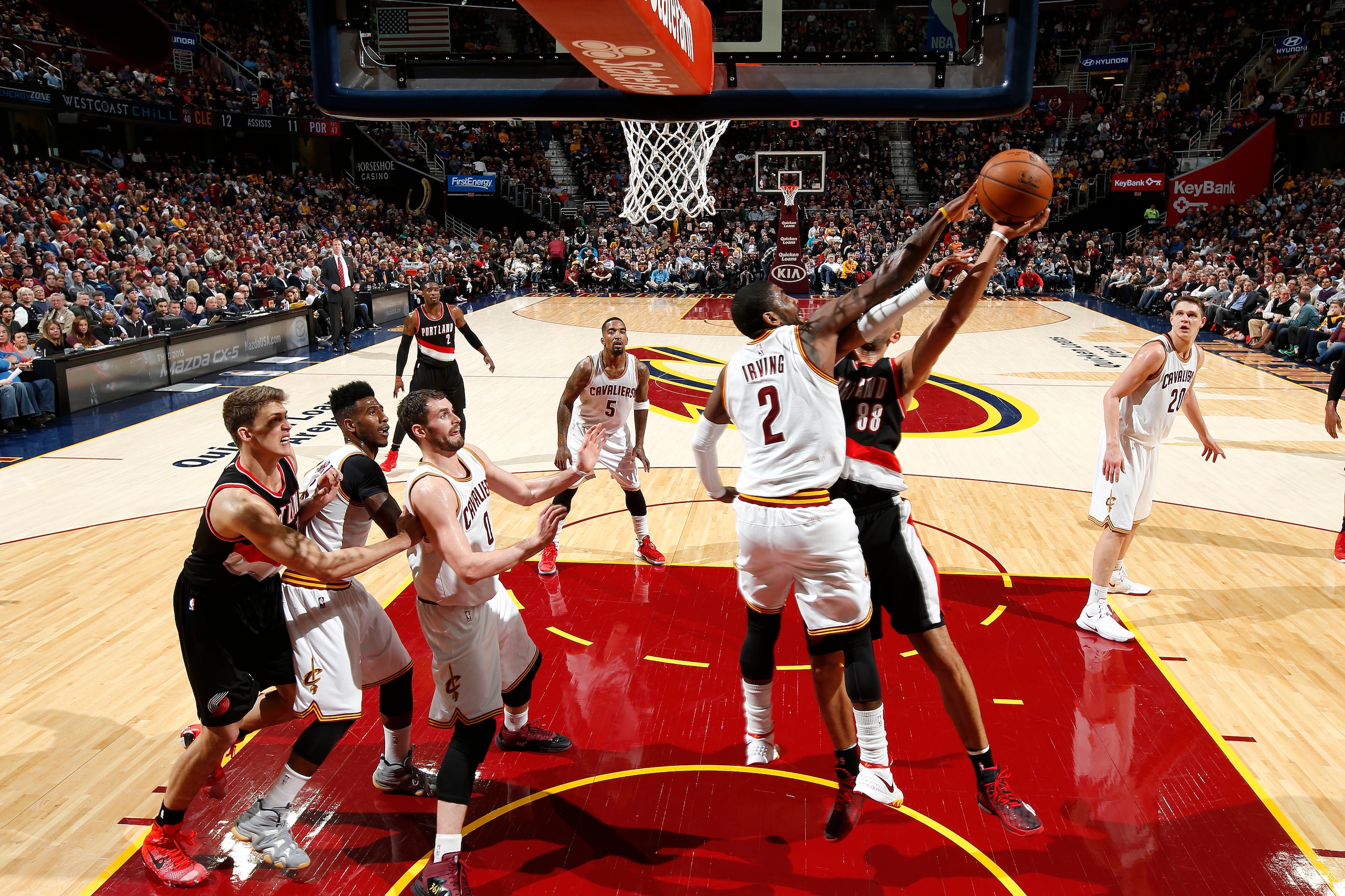 CLEVELAND, OH - JANUARY 28: Kyrie Irving #2 of the Cleveland Cavaliers blocks a shot against the Portland Trail Blazers at The Quicken Loans Arena on January 28, 2015 in Cleveland, Ohio. NOTE TO USER: User expressly acknowledges and agrees that, by downl CLEVELAND, OH - JANUARY 28: Kyrie Irving #2 of the Cleveland Cavaliers blocks a shot against the Portland Trail Blazers at The Quicken Loans Arena on January 28, 2015 in Cleveland, Ohio. NOTE TO USER: User expressly acknowledges and agrees that, by downl