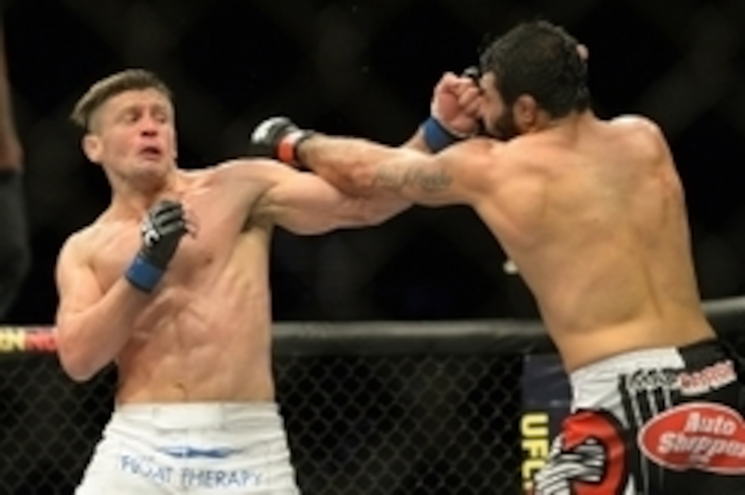 Jan 31, 2015; Las Vegas, NV, USA; Rafael Natal (red gloves) and Tom Watson (blue gloves) exchange punches during their middleweight bout during UFC 183 at the MGM Grand Garden Arena. Mandatory Credit: Jayne Kamin-Oncea-USA TODAY Sports