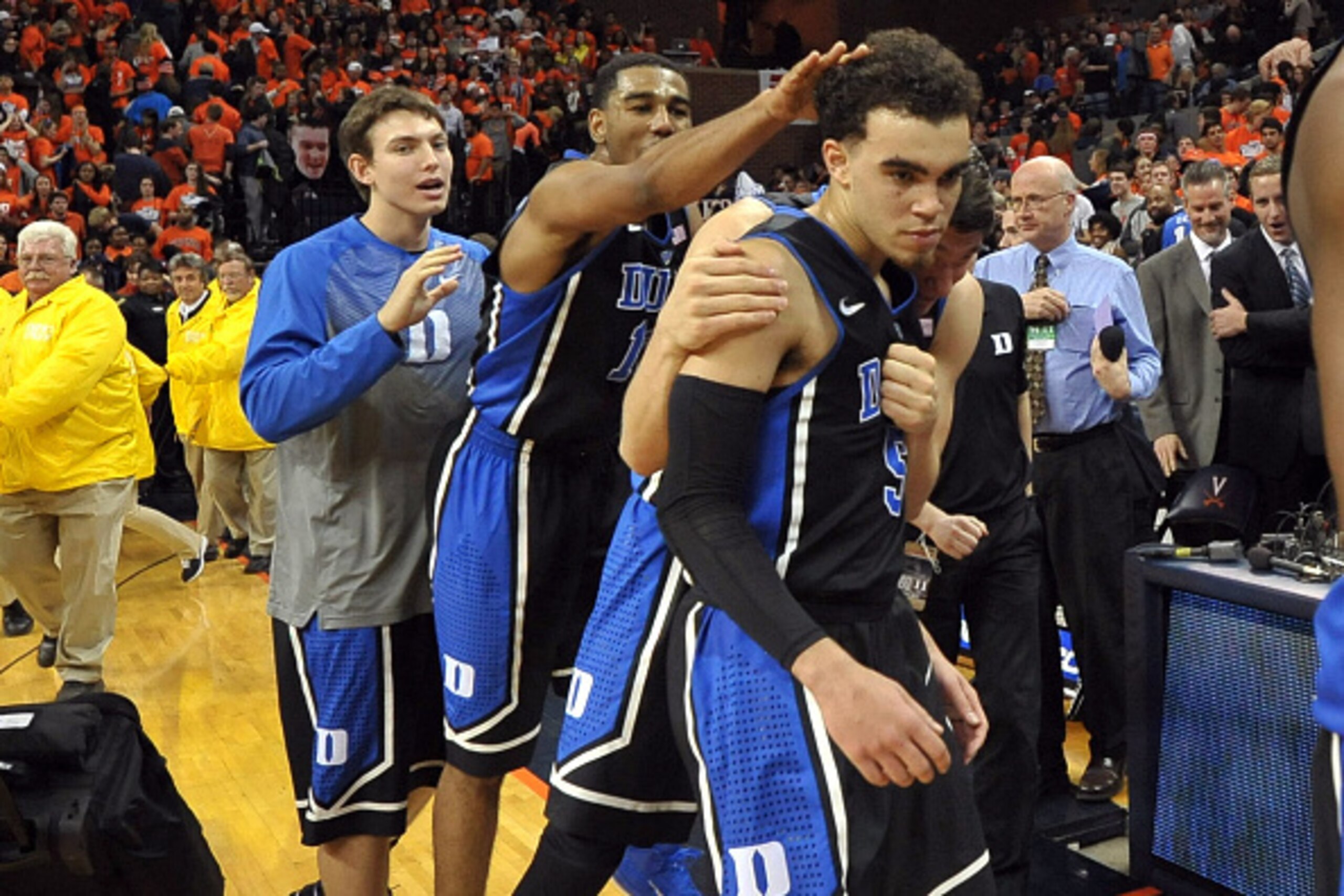 CHARLOTTESVILLE, VA - JANUARY 31: Tyus Jones #5 is congratulated by Matt Jones #13 of the Duke Blue Devils following their win against the Virginia Cavaliers at John Paul Jones Arena on January 31, 2015 in Charlottesville, Virginia. (Photo by Lance King/G