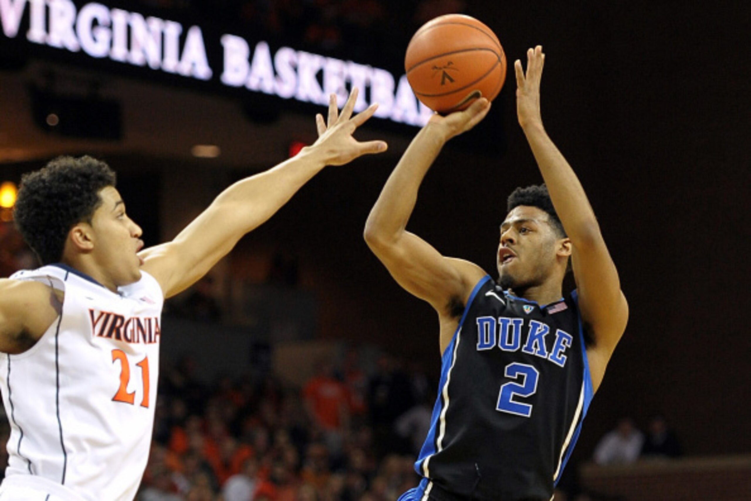 CHARLOTTESVILLE, VA - JANUARY 31: Quinn Cook #2 of the Duke Blue Devils puts up a shot against Isaiah Wilkins #21 of the Virginia Cavaliers at John Paul Jones Arena on January 31, 2015 in Charlottesville, Virginia. (Photo by Lance King/Getty Images)