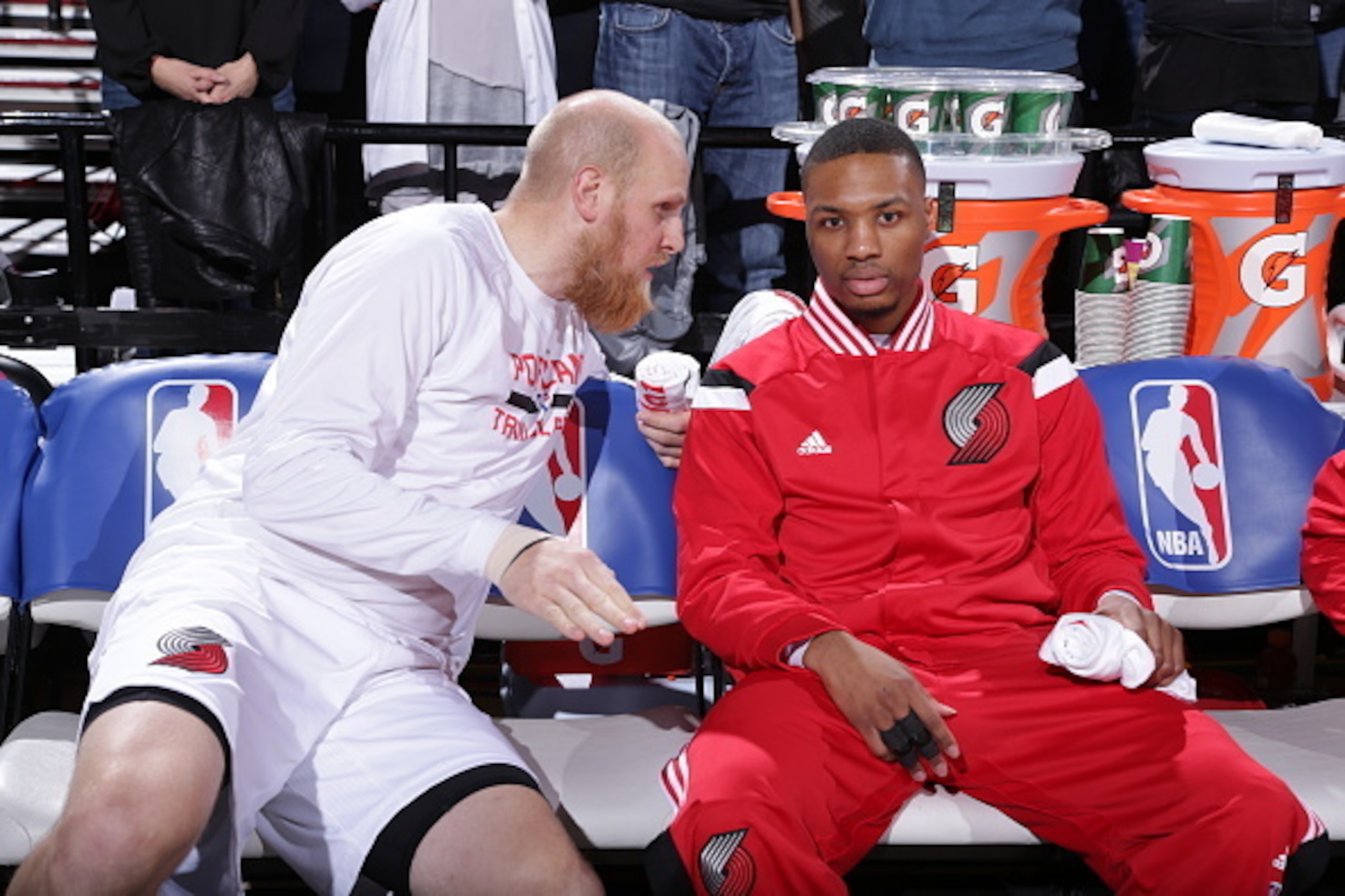 PORTLAND, OR - JANUARY 14:  Chris Kaman #35 and Damian Lillard #0 of the Portland Trail Blazers sit on the bench before the game against the Los Angeles Clippers on January 14, 2015 at the Moda Center Arena in Portland, Oregon. NOTE TO USER: User expressl