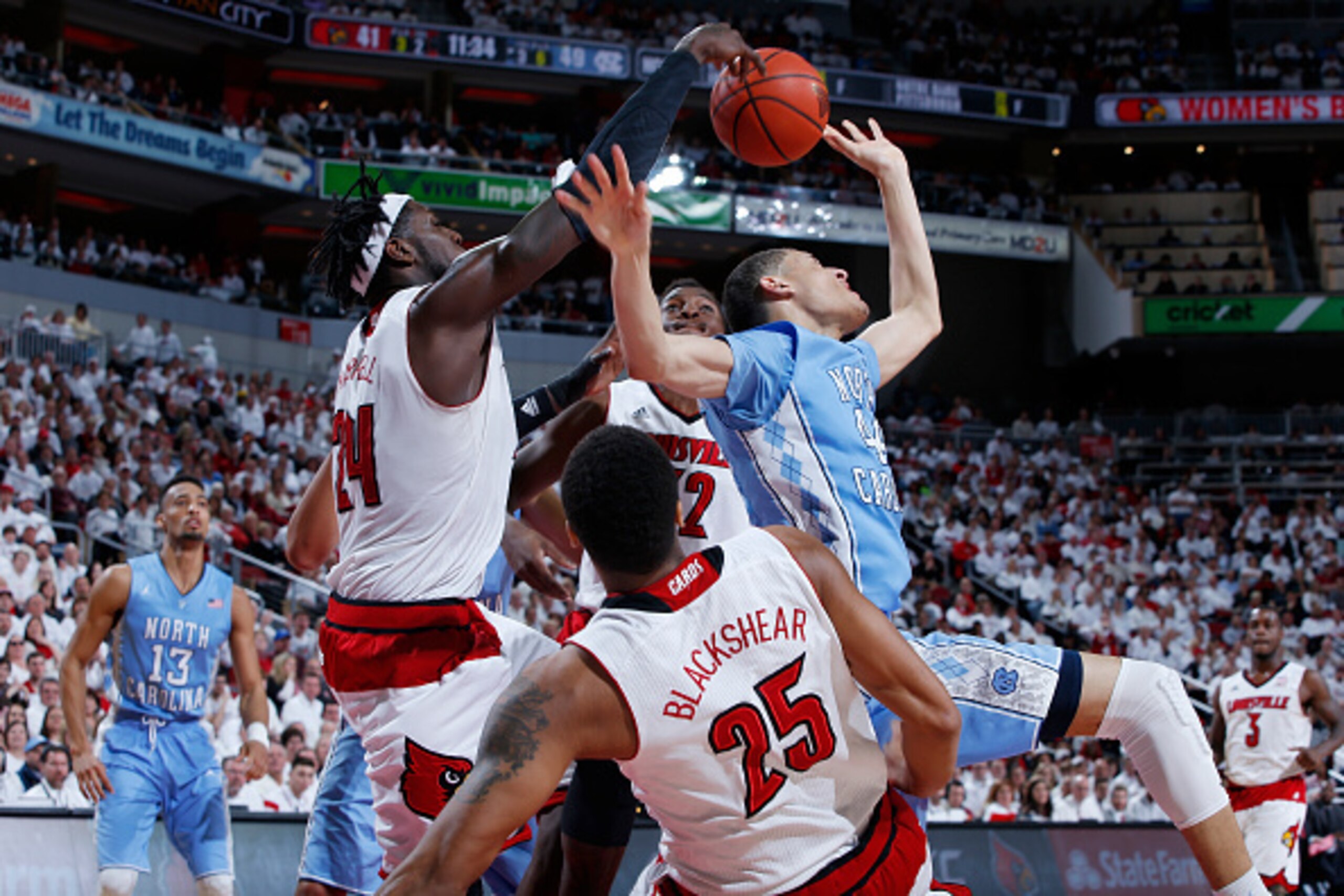 LOUISVILLE, KY - JANUARY 31: Montrezl Harrell #24 of the Louisville Cardinals blocks a shot against Justin Jackson #44 of the North Carolina Tar Heels during the game at KFC Yum! Center on January 31, 2015 in Louisville, Kentucky. Louisville defeated Nort LOUISVILLE, KY - JANUARY 31: Montrezl Harrell #24 of the Louisville Cardinals blocks a shot against Justin Jackson #44 of the North Carolina Tar Heels during the game at KFC Yum! Center on January 31, 2015 in Louisville, Kentucky. Louisville defeated Nort