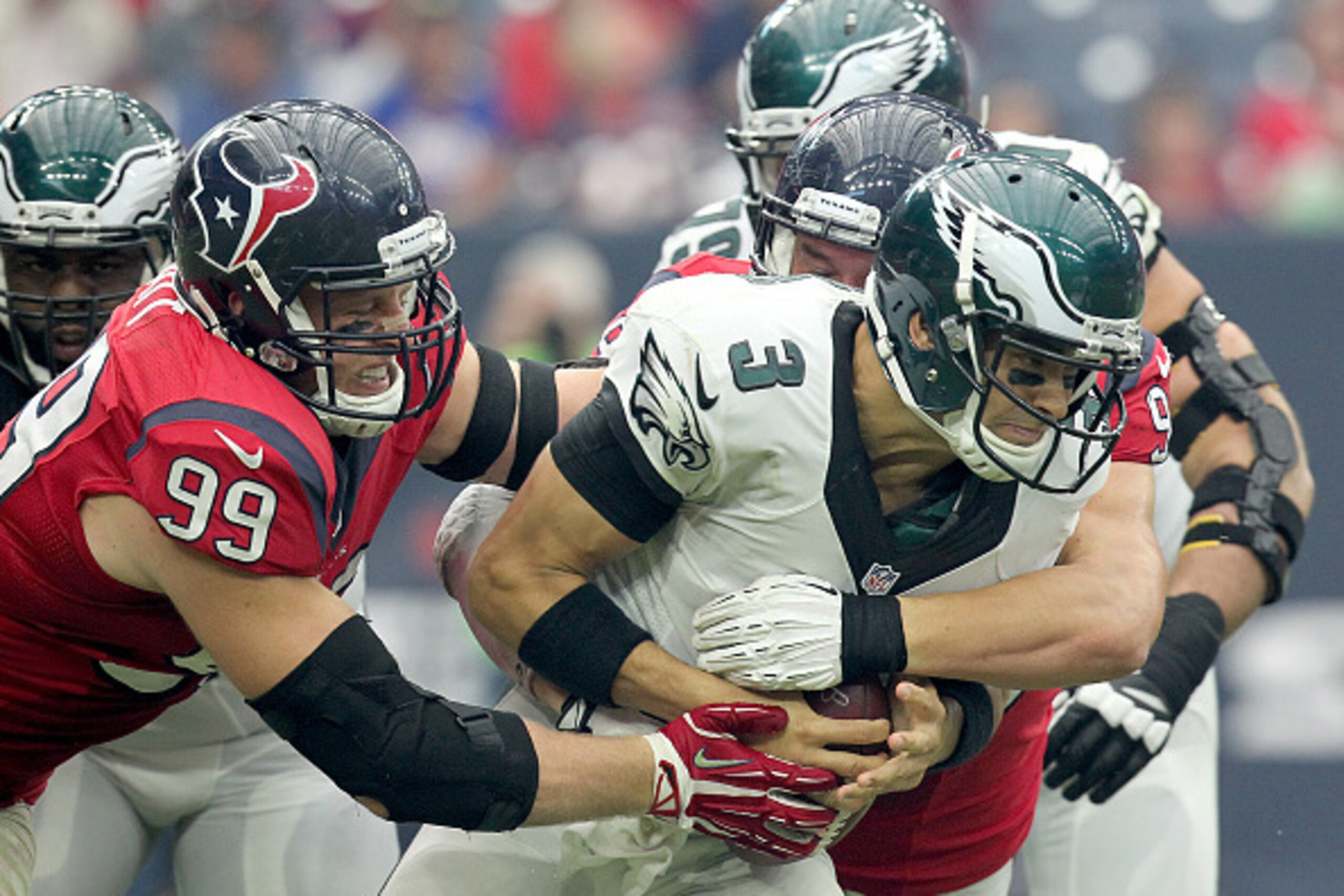 HOUSTON, TX- NOVEMBER 02: J.J. Watt #99 of the Houston Texans sacks Mark Sanchez #3 of the Philadelphia Eagles in the second half in a NFL game on November 2, 2014 at NRG Stadium in Houston, Texas. Eagles won 31 to 21. (Photo by Thomas B. Shea/Getty Image