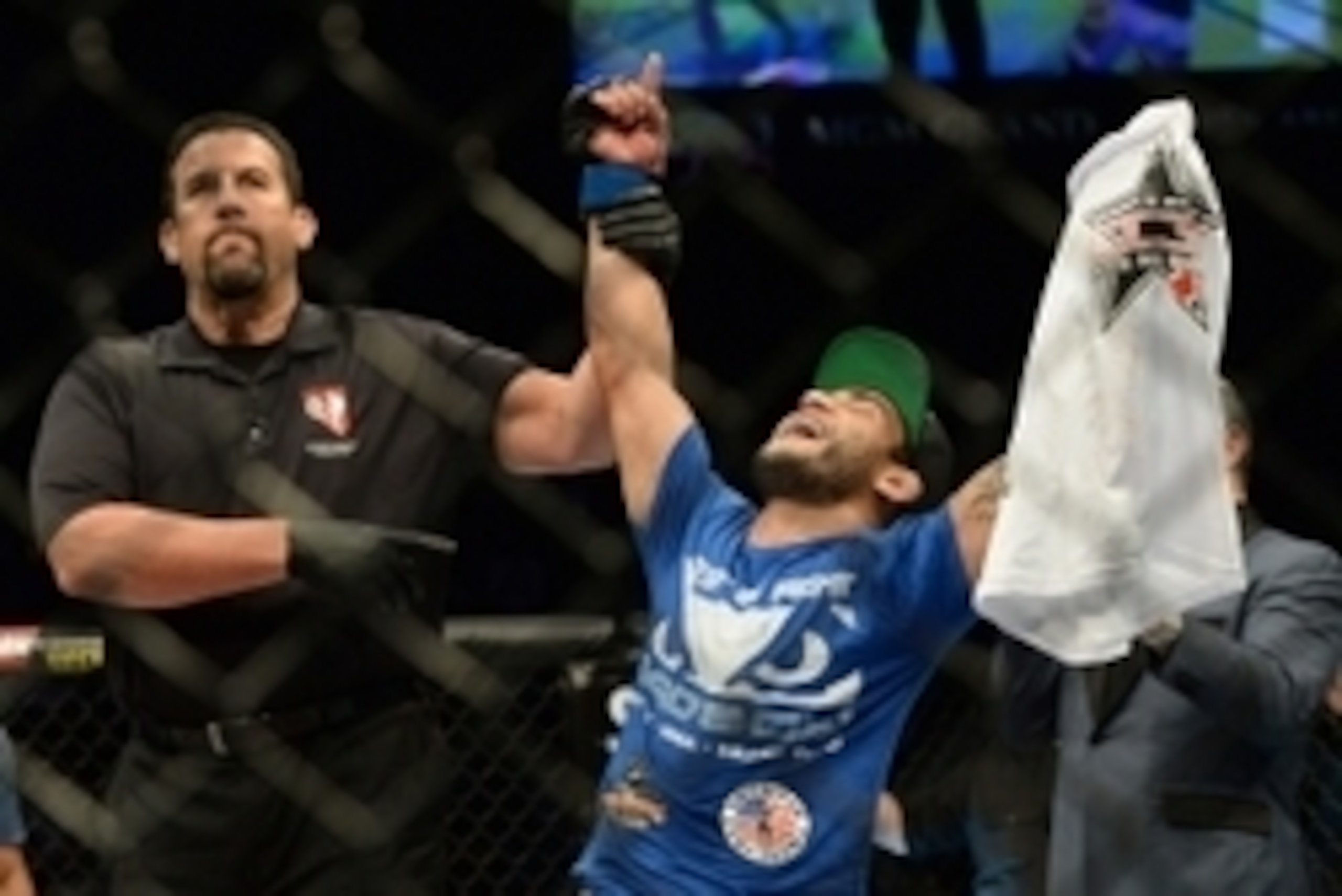 Jan 31, 2015; Las Vegas, NV, USA; Referee John McCarthy announces John Lineker (blue gloves) victorious over Ian McCall (not pictured) following their lightweight bout during UFC 183 at the MGM Grand Garden Arena. Mandatory Credit: Jayne Kamin-Oncea-USA T