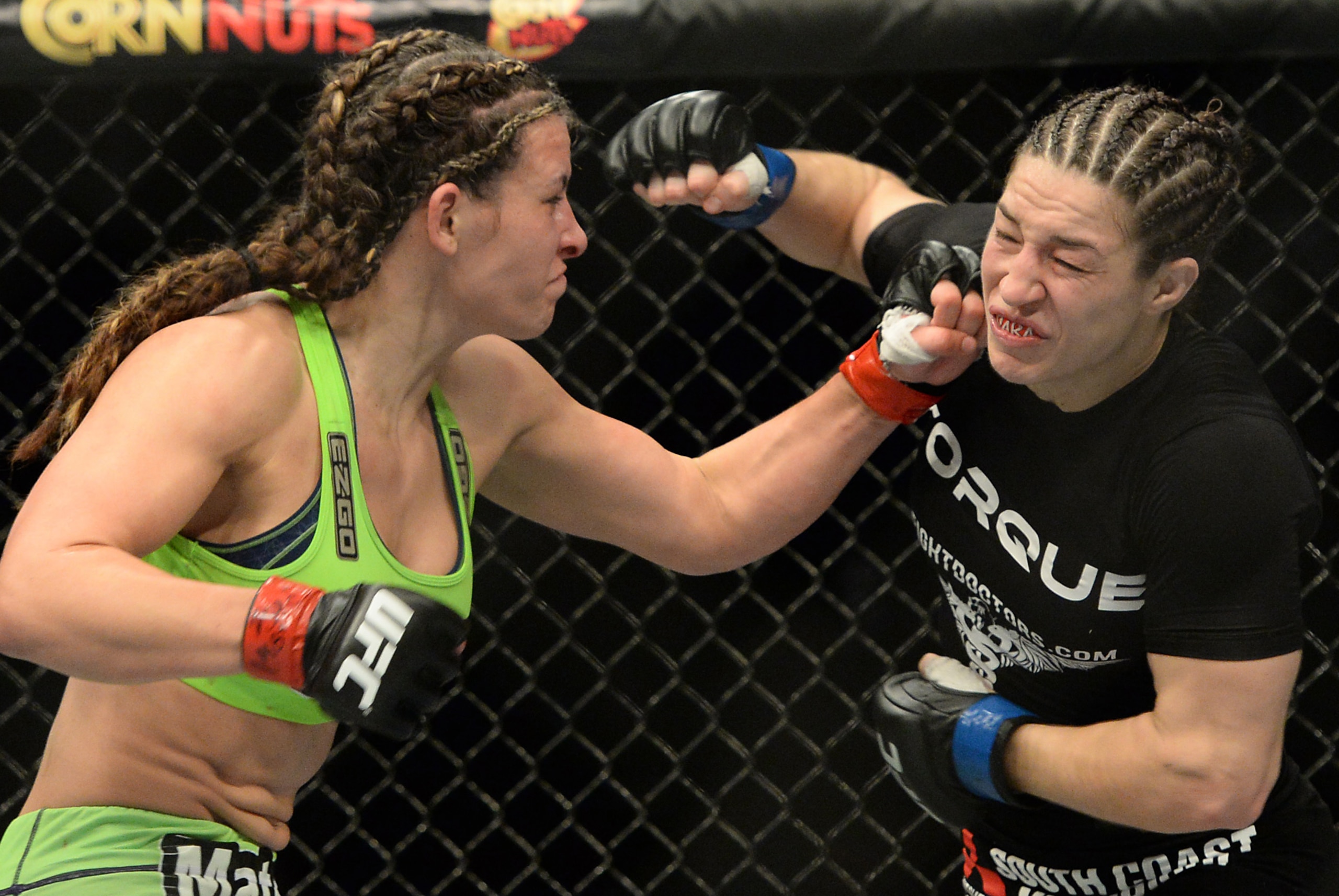 Jan 31, 2015; Las Vegas, NV, USA;  Miesha Tate (red gloves) fights Sara McMann (blue gloves) during their women's bantamweight bout during UFC 183 at the MGM Grand Garden Arena. Mandatory Credit: Jayne Kamin-Oncea-USA TODAY Sports