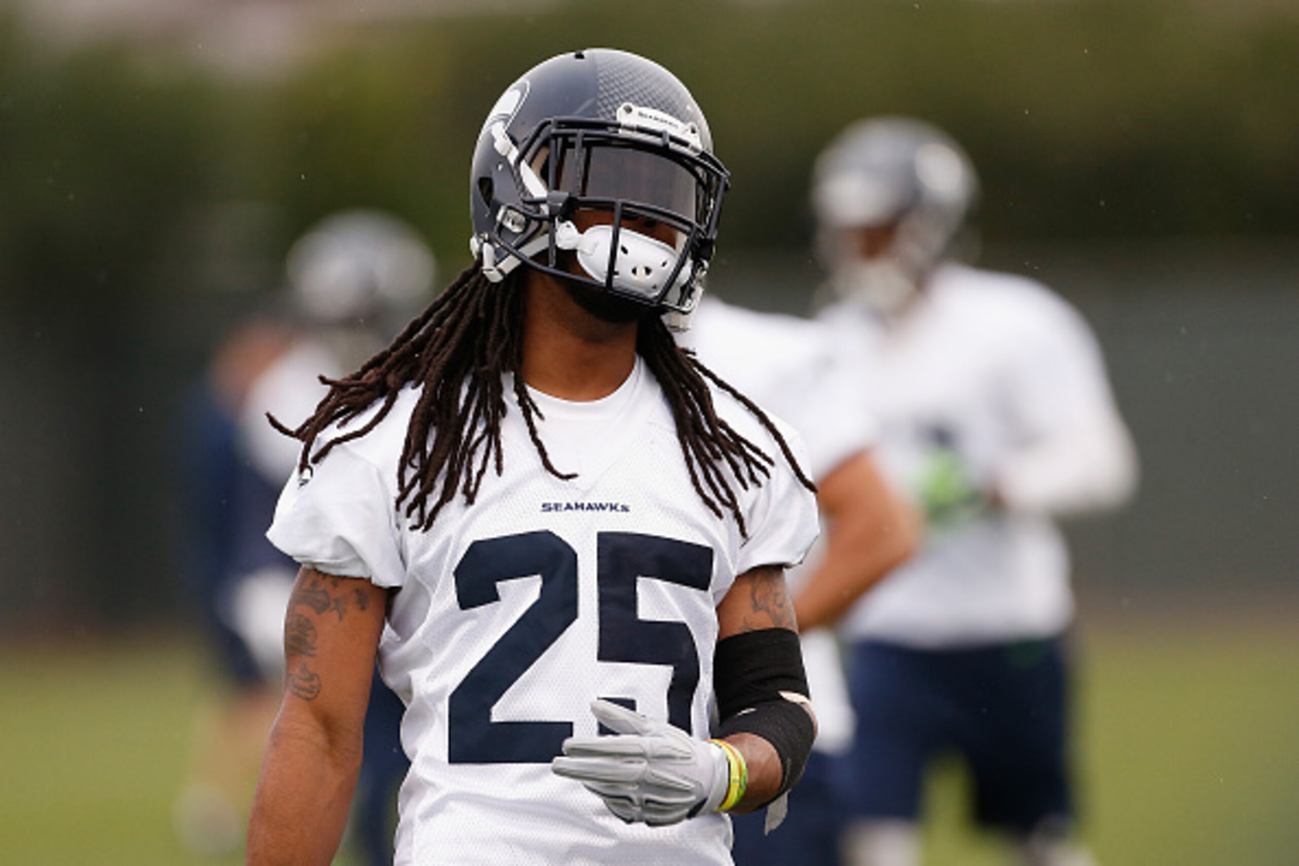 TEMPE, AZ - JANUARY 29:  Cornerback Richard Sherman #25 of the Seattle Seahawks warms up during a practice at Arizona State University on January 29, 2015 in Tempe, Arizona.  (Photo by Christian Petersen/Getty Images)