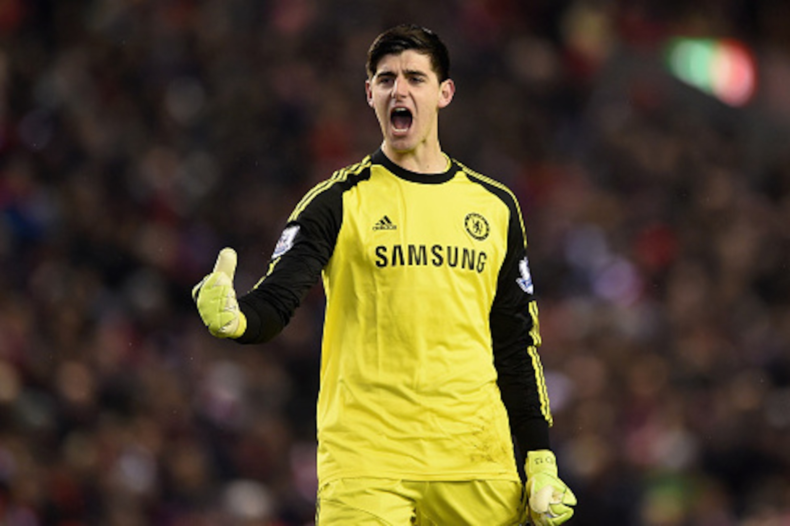 LIVERPOOL, ENGLAND - JANUARY 20: Thibaut Courtois of Chelsea celebrates as Eden Hazard of Chelsea (not pictured) scores the opening goal from the penalty spot during the Capital One Cup Semi-Final first leg match between Liverpool and Chelsea at Anfield o