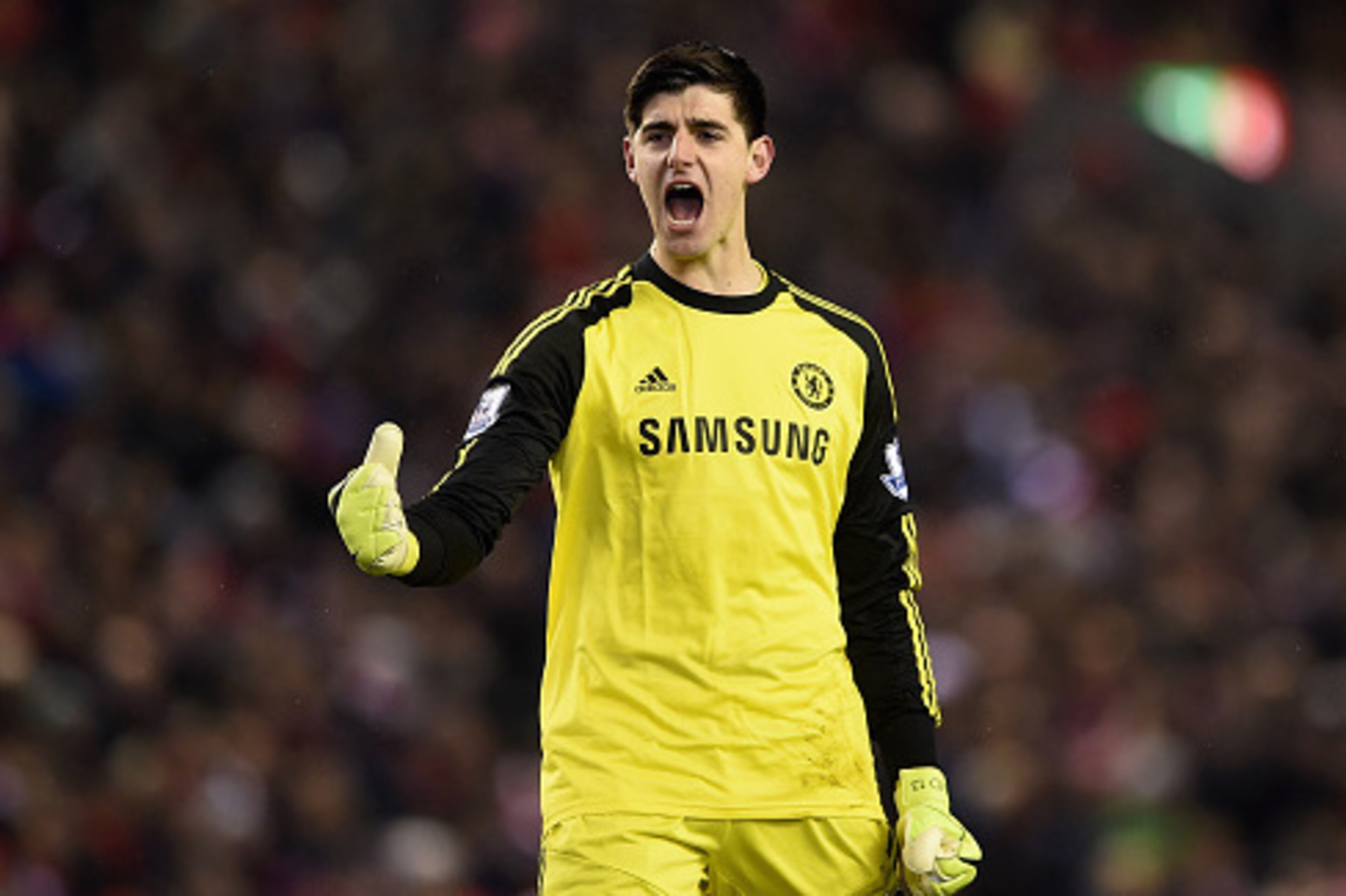LIVERPOOL, ENGLAND - JANUARY 20: Thibaut Courtois of Chelsea celebrates as Eden Hazard of Chelsea (not pictured) scores the opening goal from the penalty spot during the Capital One Cup Semi-Final first leg match between Liverpool and Chelsea at Anfield o LIVERPOOL, ENGLAND - JANUARY 20: Thibaut Courtois of Chelsea celebrates as Eden Hazard of Chelsea (not pictured) scores the opening goal from the penalty spot during the Capital One Cup Semi-Final first leg match between Liverpool and Chelsea at Anfield o
