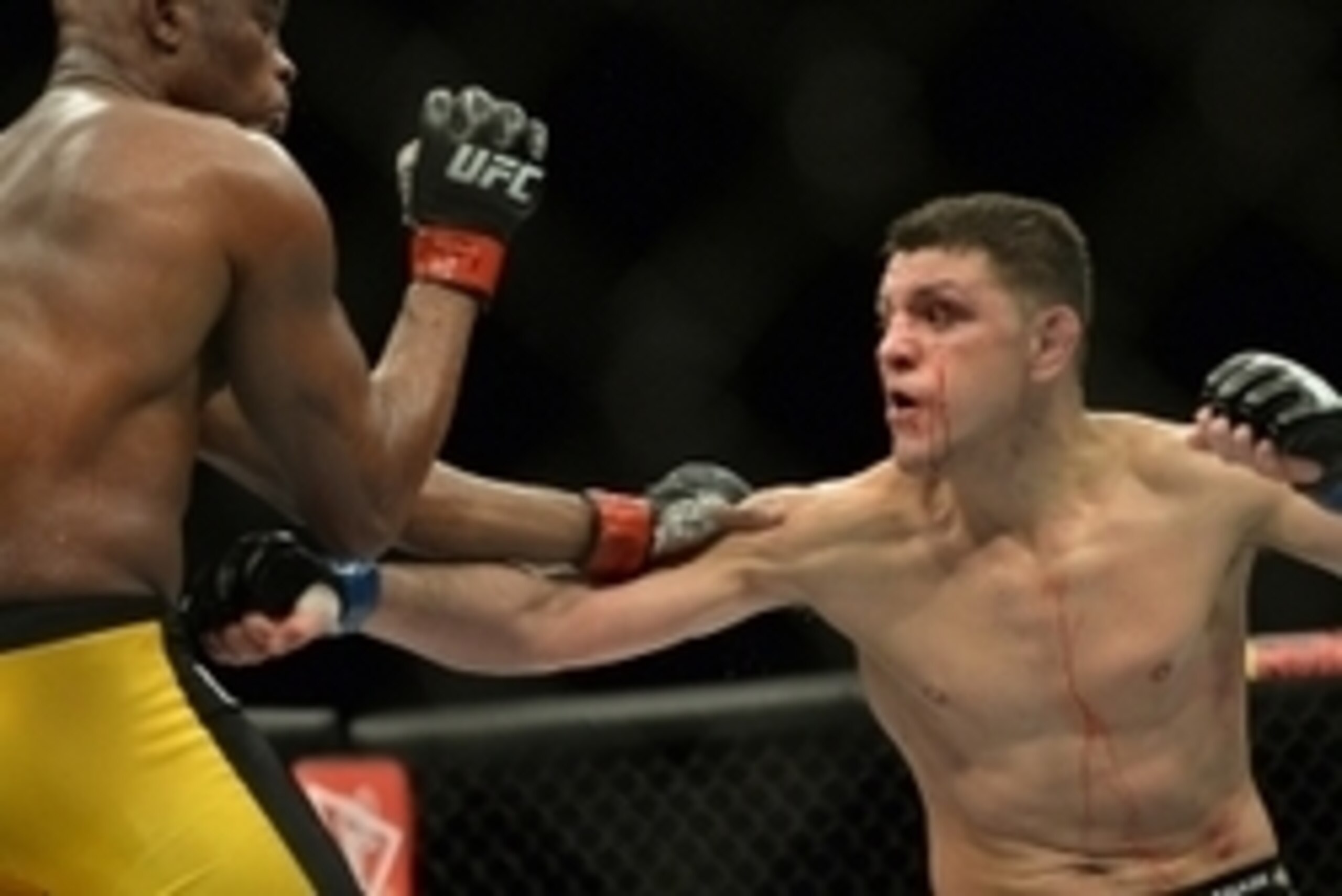 Jan 31, 2015; Las Vegas, NV, USA; Anderson Silva (red gloves) and Nick Diaz (blue gloves) fight during their middleweight bout during UFC 183 at the MGM Grand Garden Arena. Mandatory Credit: Jayne Kamin-Oncea-USA TODAY Sports