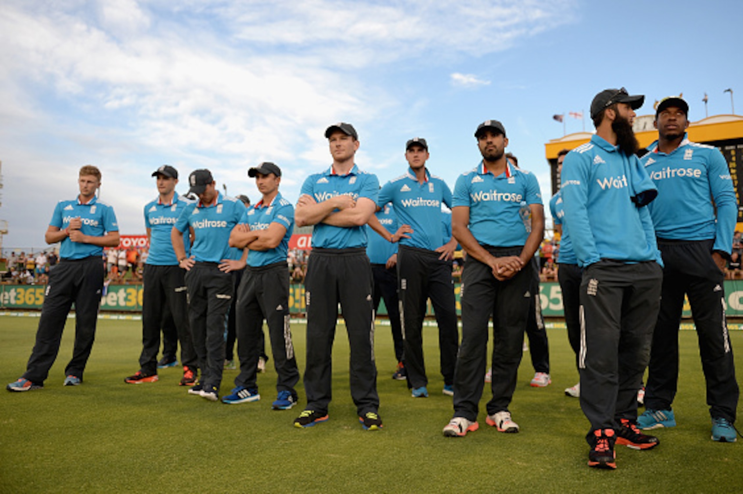 PERTH, AUSTRALIA - FEBRUARY 01:  England captain Eoin Morgan and his team watch the presentations after losing the final match of the Carlton Mid One Day International series between Australia and England at WACA on February 1, 2015 in Perth, Australia.  