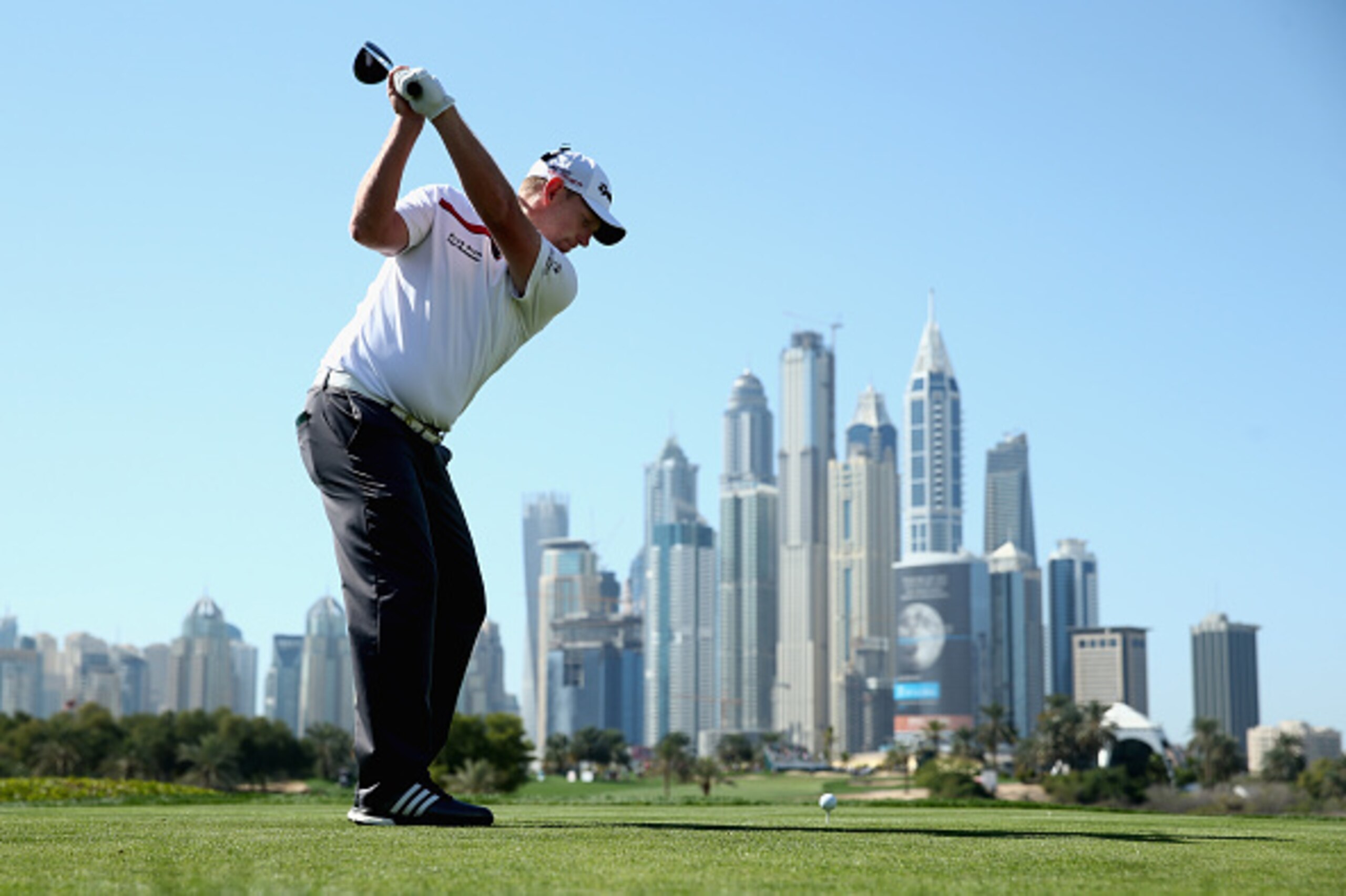 DUBAI, UNITED ARAB EMIRATES - JANUARY 31:  Stephen Gallacher of Scotland tees off on the eighth hole during the third round of the Omega Dubai Desert Classic on the Majlis Course at the Emirates Golf Club on January 31, 2015 in Dubai, United Arab Emirates