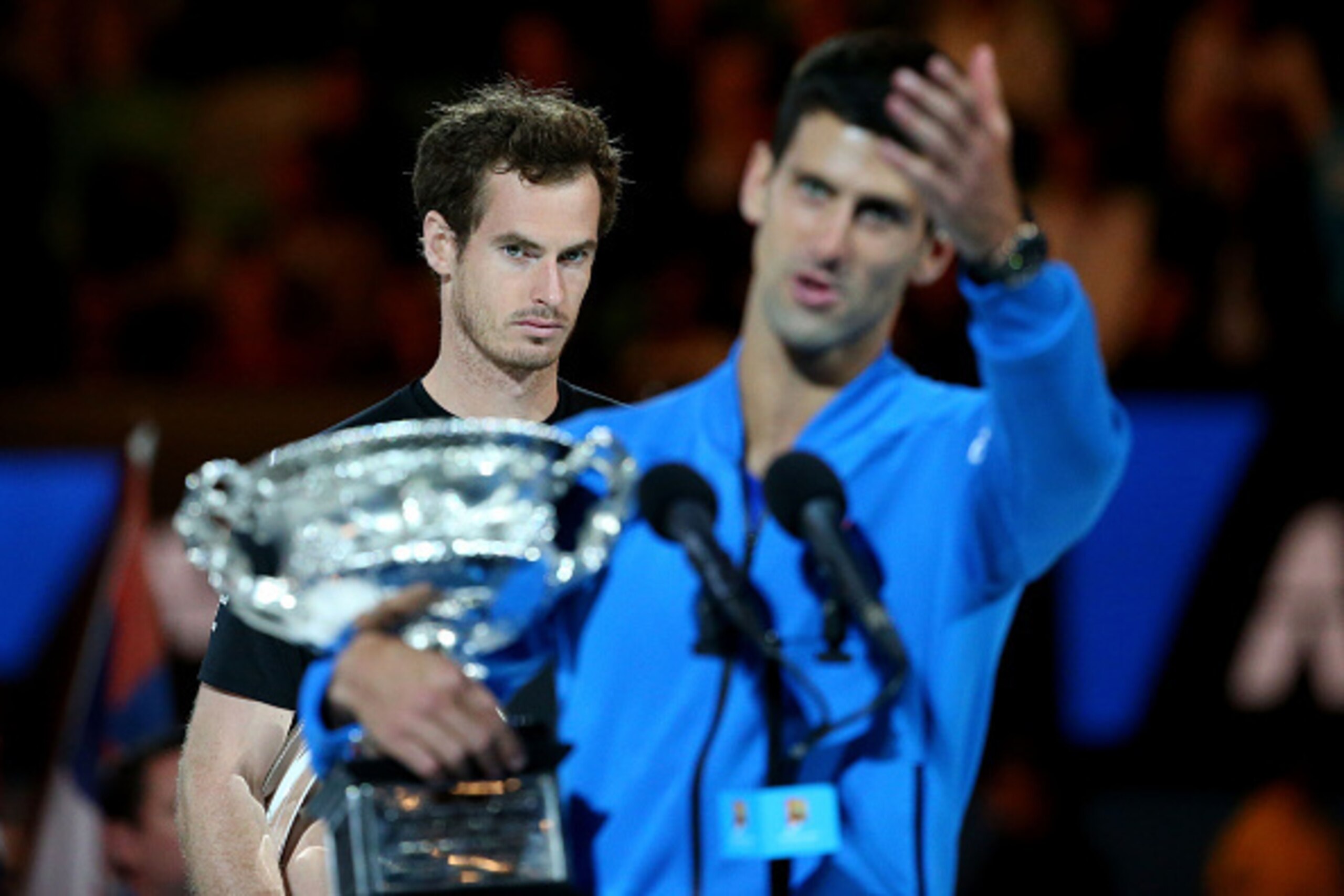 MELBOURNE, AUSTRALIA - FEBRUARY 01:  Andy Murray of Great Britain looks on as Novak Djokovic of Serbia holds the Norman Brookes Challenge Cup after he won their men's final match during day 14 of the 2015 Australian Open at Melbourne Park on February 1, 2