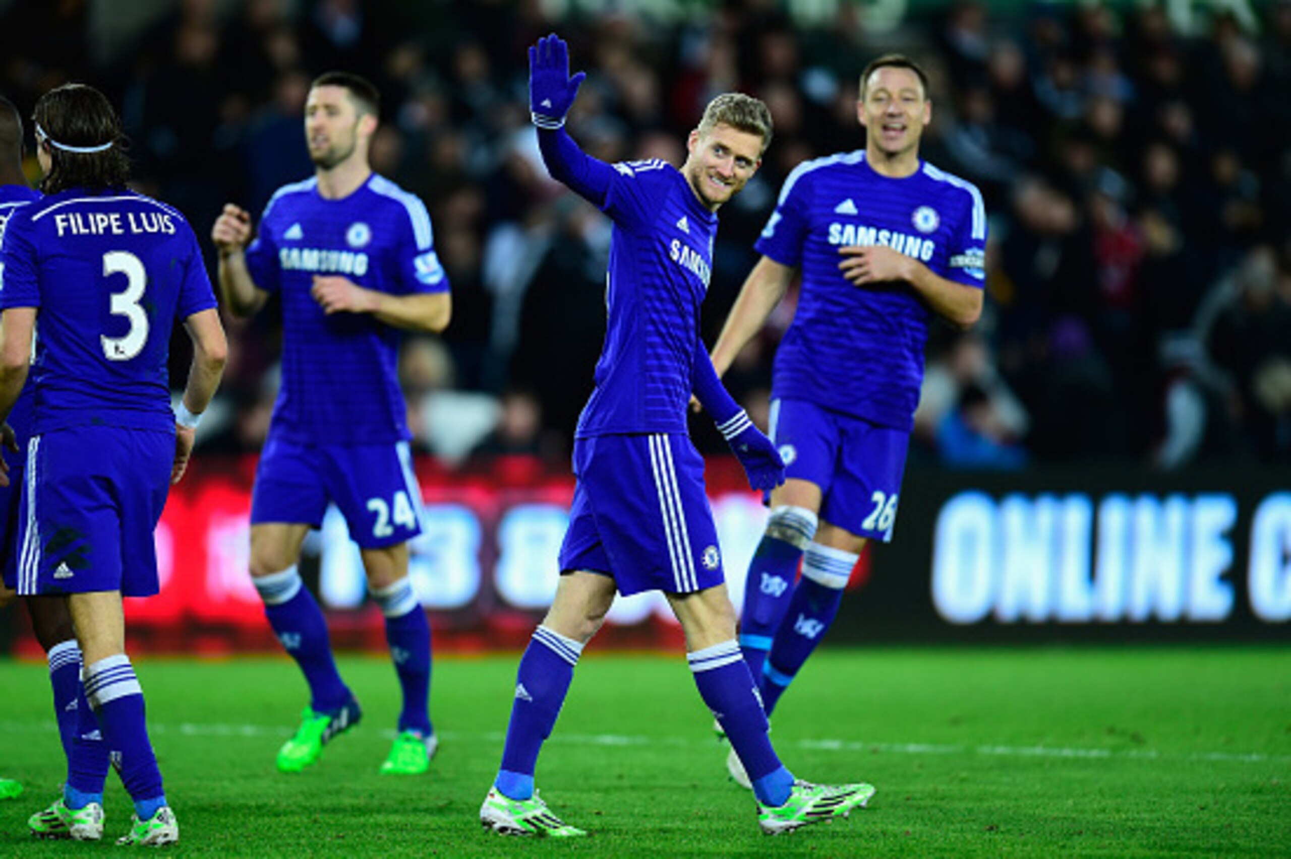 SWANSEA, WALES - JANUARY 17:  Chelsea player Andre Schurrle celebrates after scoring the fifth goal during the Barclays Premier League match between Swansea City and Chelsea at Liberty Stadium on January 17, 2015 in Swansea, Wales.  (Photo by Stu Forster/