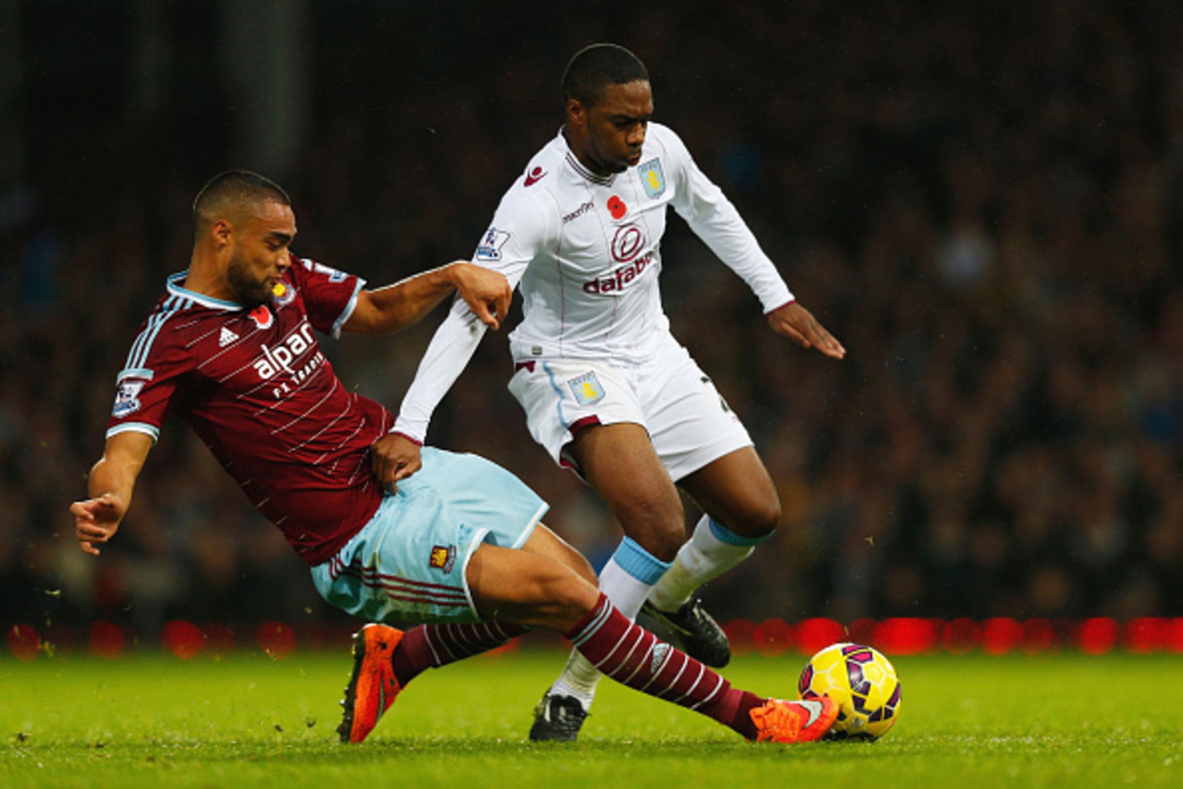 LONDON, ENGLAND - NOVEMBER 08:  Charles N'Zogbia of Aston Villa is tackled by Winston Reid of West Ham United during the Barclays Premier League match between West Ham United and Aston Villa at Boleyn Ground on November 8, 2014 in London, England.  (Photo
