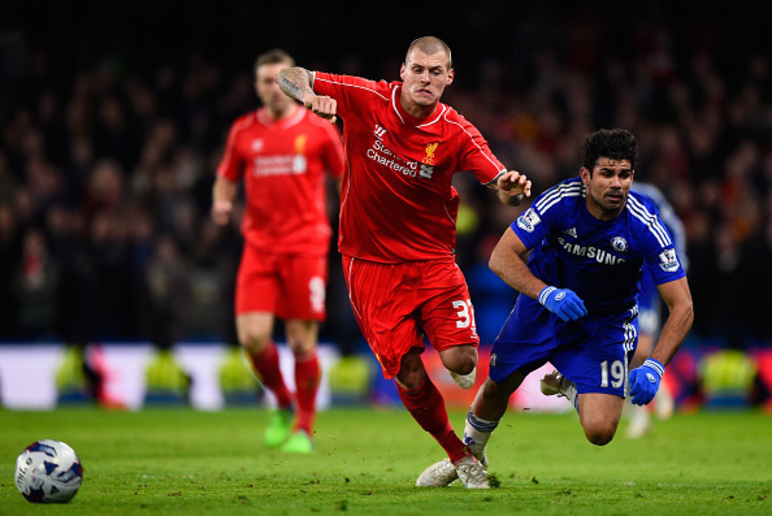 LONDON, ENGLAND - JANUARY 27: Martin Skrtel of Liverpool brings down Diego Costa of Chelsea during the Capital One Cup Semi-Final second leg between Chelsea and Liverpool at Stamford Bridge on January 27, 2015 in London, England. (Photo by Mike Hewitt/G LONDON, ENGLAND - JANUARY 27: Martin Skrtel of Liverpool brings down Diego Costa of Chelsea during the Capital One Cup Semi-Final second leg between Chelsea and Liverpool at Stamford Bridge on January 27, 2015 in London, England. (Photo by Mike Hewitt/G