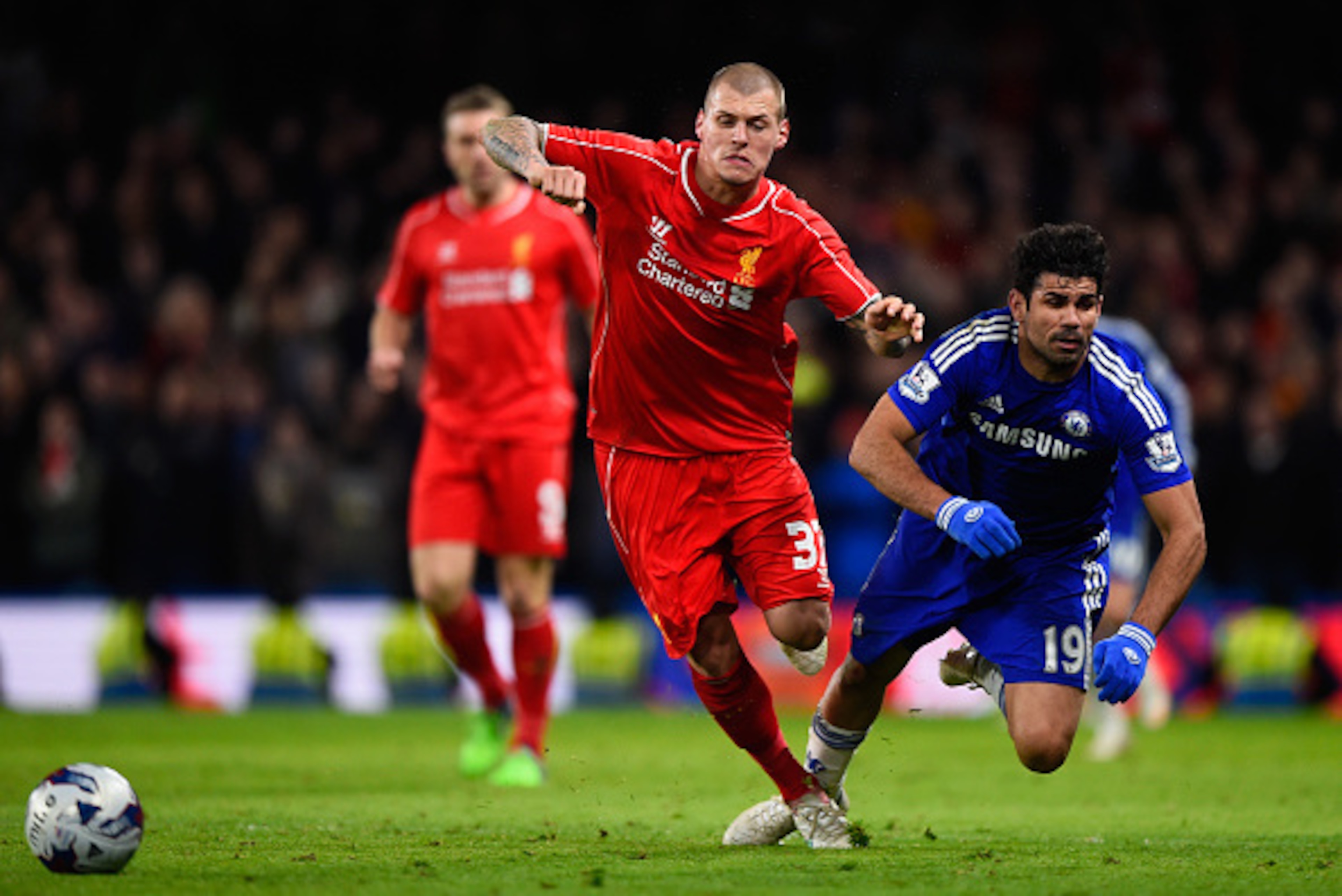 LONDON, ENGLAND - JANUARY 27: Martin Skrtel of Liverpool brings down Diego Costa of Chelsea  during the Capital One Cup Semi-Final second leg between Chelsea and Liverpool at Stamford Bridge on January 27, 2015 in London, England.  (Photo by Mike Hewitt/G