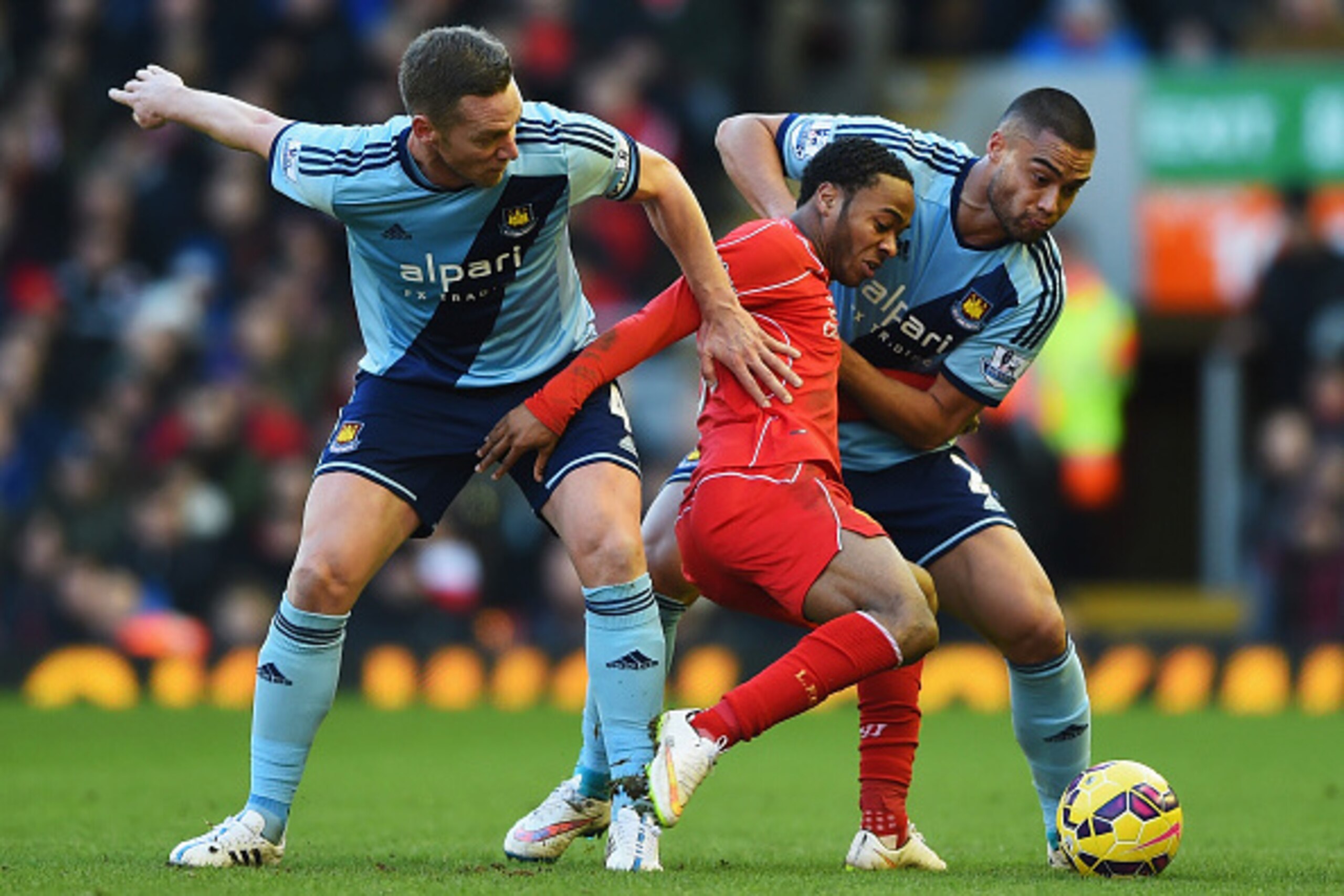 LIVERPOOL, ENGLAND - JANUARY 31: Raheem Sterling of Liverpool is crowded out by Kevin Nolan and Winston Reid of West Ham during the Barclays Premier League match between Liverpool and West Ham United at Anfield on January 31, 2015 in Liverpool, England. LIVERPOOL, ENGLAND - JANUARY 31: Raheem Sterling of Liverpool is crowded out by Kevin Nolan and Winston Reid of West Ham during the Barclays Premier League match between Liverpool and West Ham United at Anfield on January 31, 2015 in Liverpool, England.