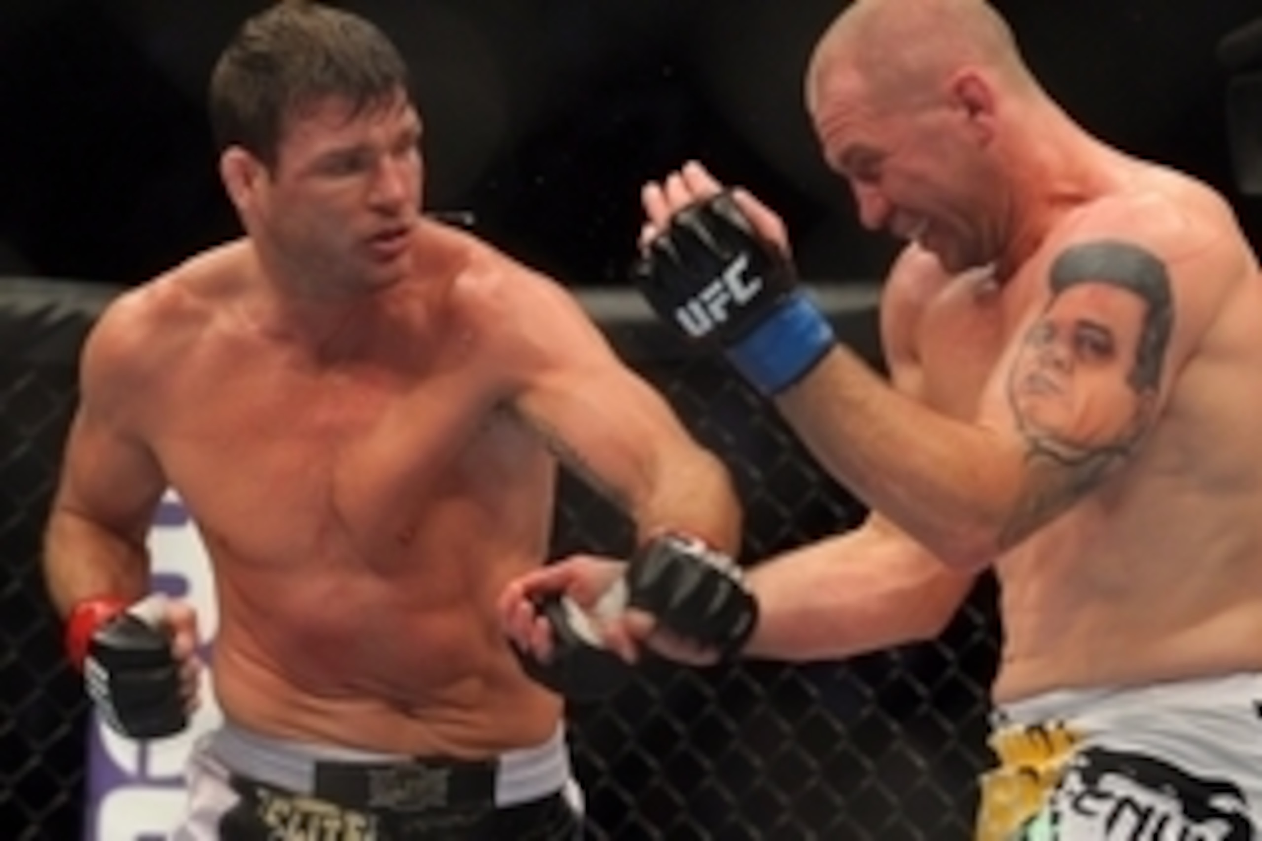 Apr 27, 2013; Newark, NJ, USA; Michael Bisping (red gloves) competes against Alan Belcher (blue gloves) during UFC 159 at the Prudential Center. Mandatory Credit: Brad Penner-USA TODAY Sports
