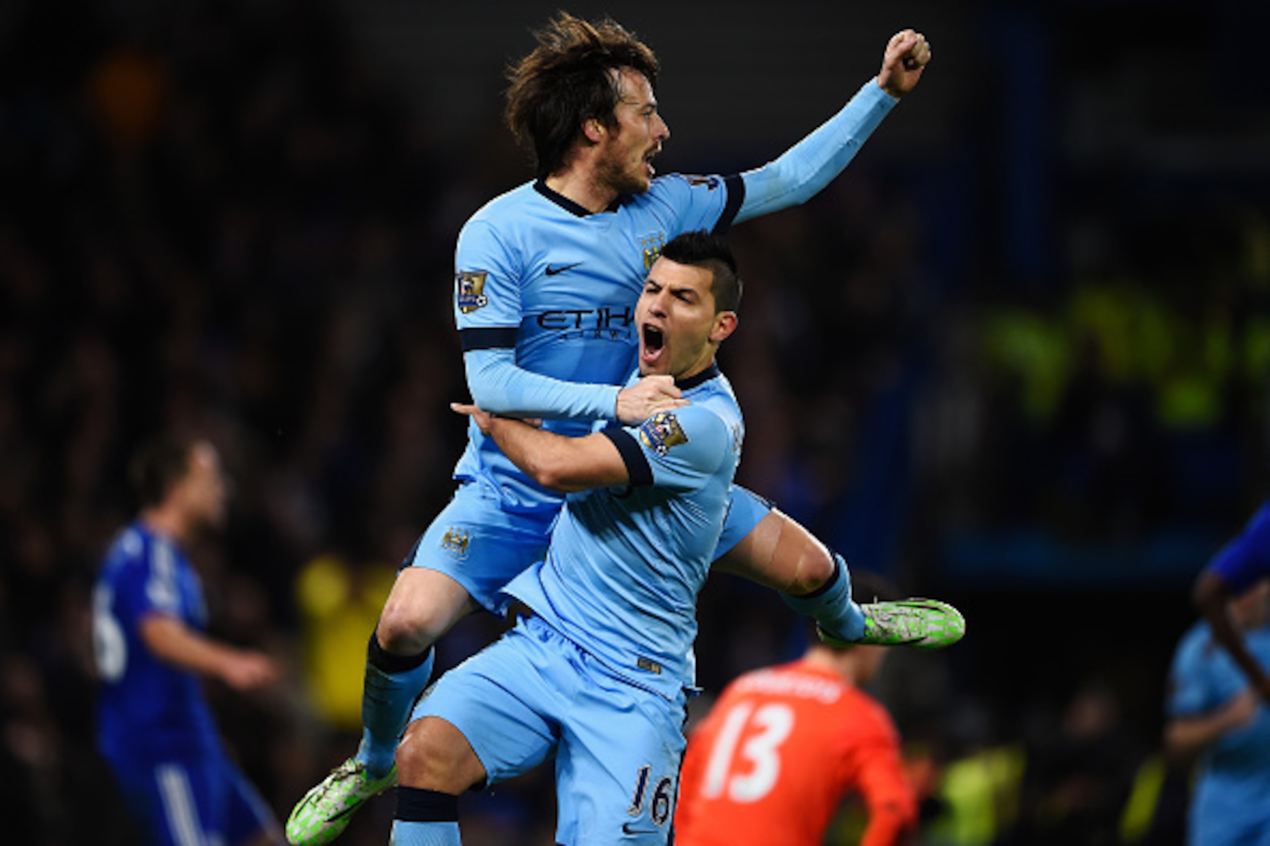 LONDON, ENGLAND - JANUARY 31: Goalscorer David Silva of Manchester City (L) celebrates with teammate Sergio Aguero after scoring the equalising goal during the Barclays Premier League match between Chelsea and Manchester City at Stamford Bridge on January LONDON, ENGLAND - JANUARY 31: Goalscorer David Silva of Manchester City (L) celebrates with teammate Sergio Aguero after scoring the equalising goal during the Barclays Premier League match between Chelsea and Manchester City at Stamford Bridge on January