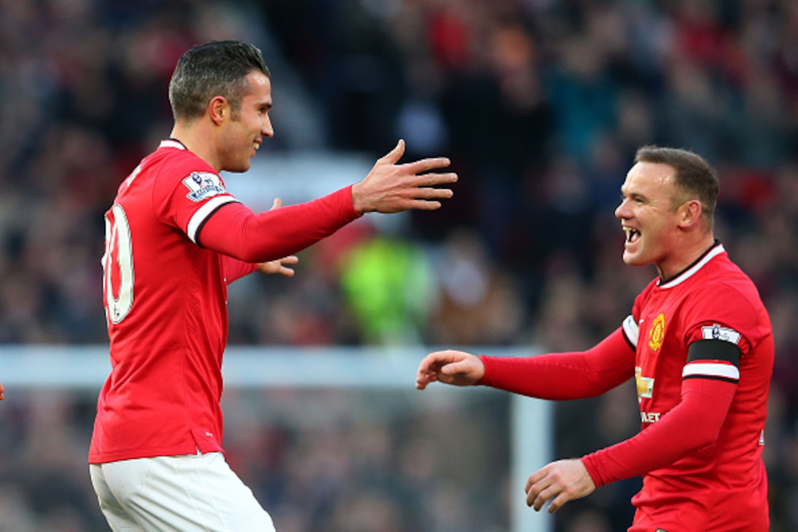 MANCHESTER, ENGLAND - JANUARY 31:  (L-R) Robin van Persie of Manchester United is congratulated by teammate Wayne Rooney after scoring his team's first goal during the Barclays Premier League match between Manchester United and Leicester City at Old Traff