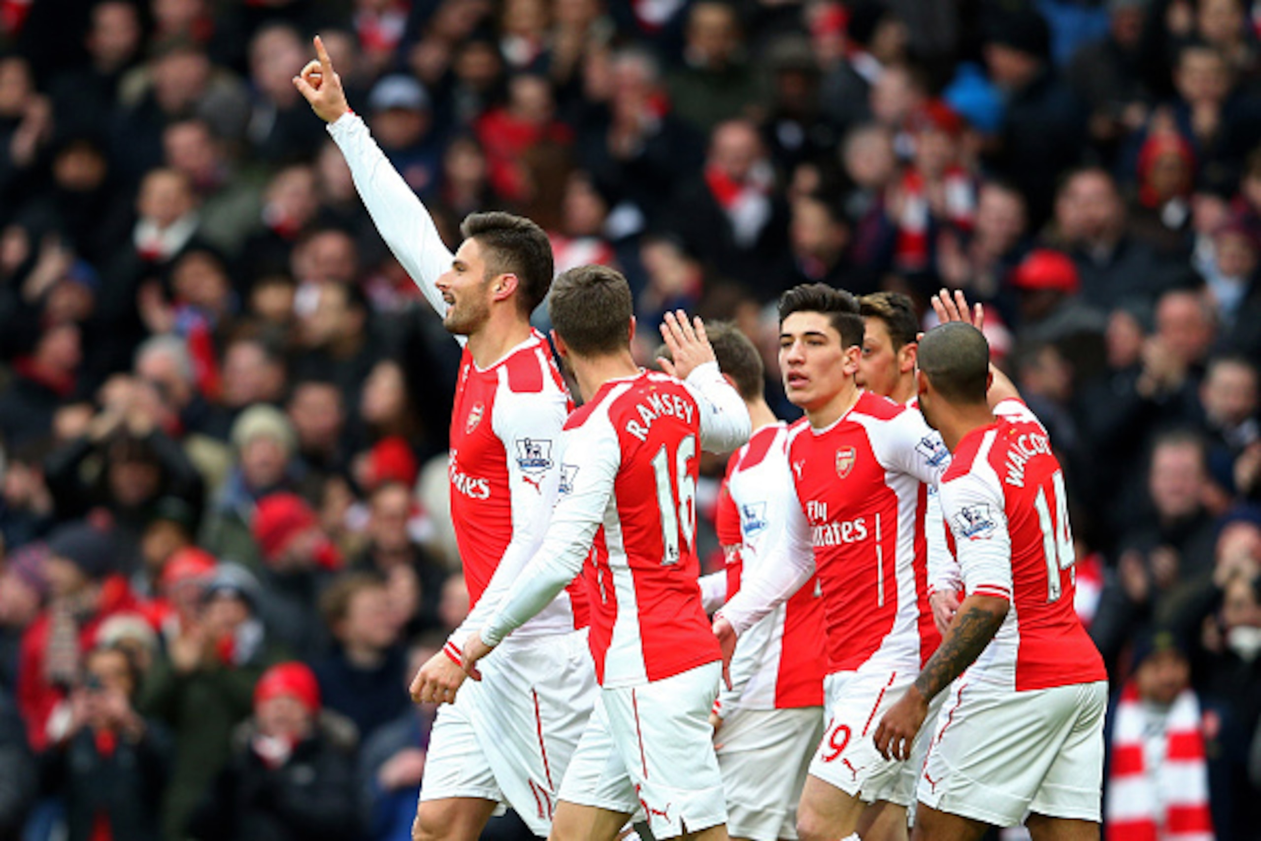 LONDON, ENGLAND - FEBRUARY 01: Olivier Giroud (L) of Arsenal celebrates with teammates after scoring the opening goal during the Barclays Premier League match between Arsenal and Aston Villa at the Emirates Stadium on February 1, 2015 in London, England. LONDON, ENGLAND - FEBRUARY 01: Olivier Giroud (L) of Arsenal celebrates with teammates after scoring the opening goal during the Barclays Premier League match between Arsenal and Aston Villa at the Emirates Stadium on February 1, 2015 in London, England.