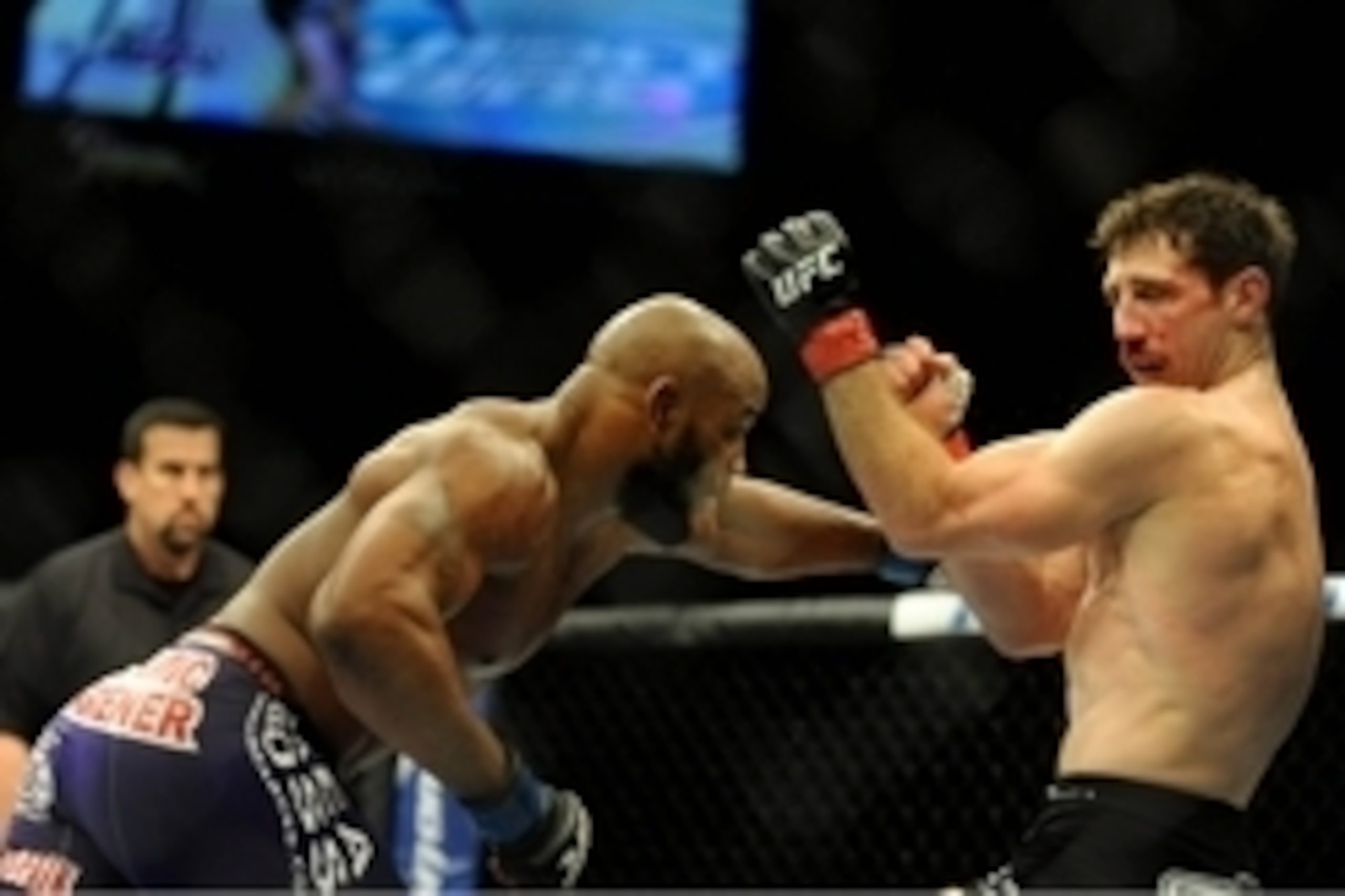 Sep 27, 2014; Las Vegas, NV, USA; Yoel Romero (blue gloves) fights Tim Kennedy (red gloves) during a middleweight fight during UFC 178 at MGM Grand Garden Arena. Mandatory Credit: Stephen R. Sylvanie-USA TODAY Sports