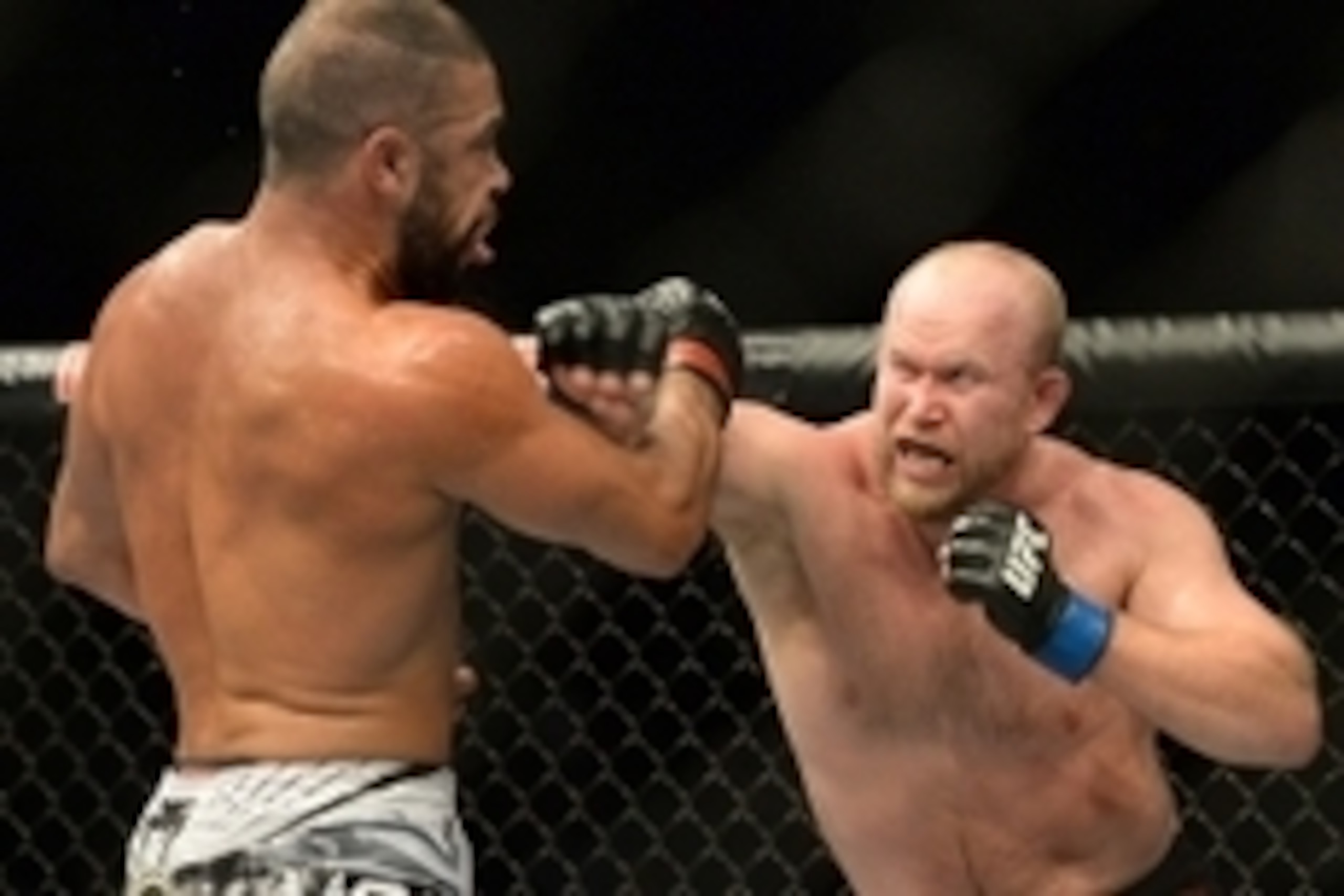Jan 31, 2015; Las Vegas, NV, USA;  Thales Leites (red gloves) takes a punch from Tim Boetsch (blue gloves) during their middleweight bout during UFC 183 at the MGM Grand Garden Arena. Mandatory Credit: Jayne Kamin-Oncea-USA TODAY Sports
