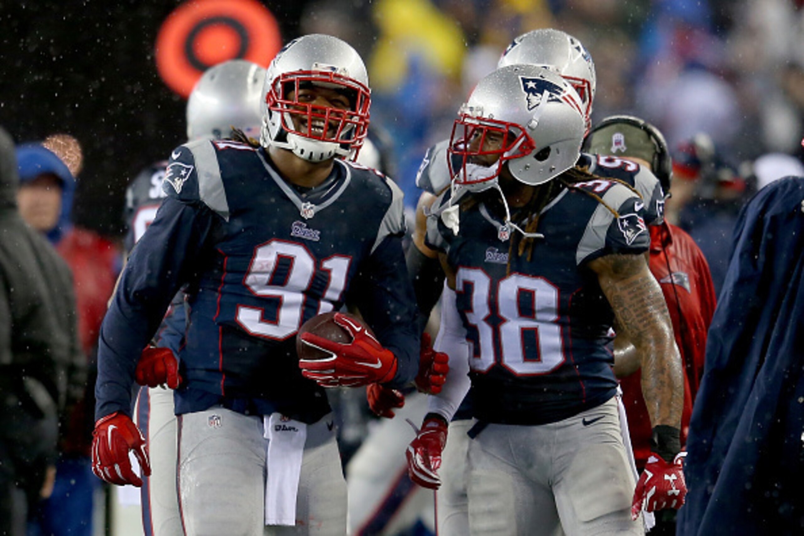 FOXBORO, MA - JANUARY 18:   Jamie Collins #91 and Brandon Bolden #38 of the New England Patriots react against the Indianapolis Colts of the 2015 AFC Championship Game at Gillette Stadium on January 18, 2015 in Foxboro, Massachusetts.  (Photo by Jim Rogas