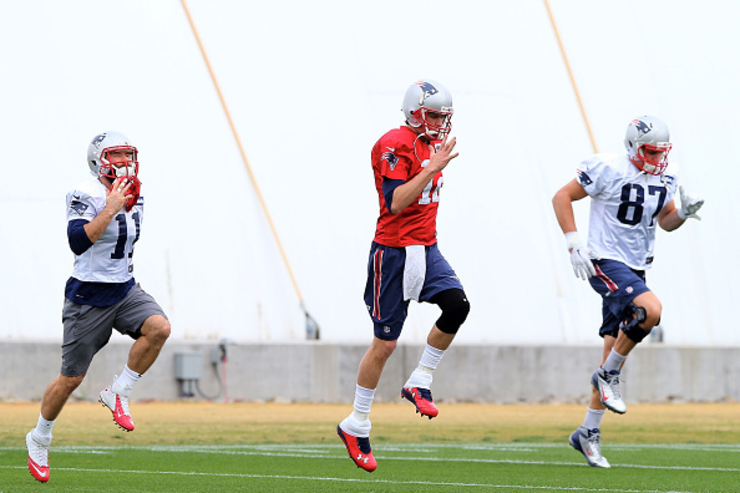 TEMPE, AZ - JANUARY 29:  Julian Edelman #11,Tom Brady #12 and Rob Gronkowski #87 of the New England Patriots warm up during the New England Patriots Super Bowl XLIX Practice on January 29, 2015 at the Arizona Cardinals Practice Facility in Tempe, Arizona.